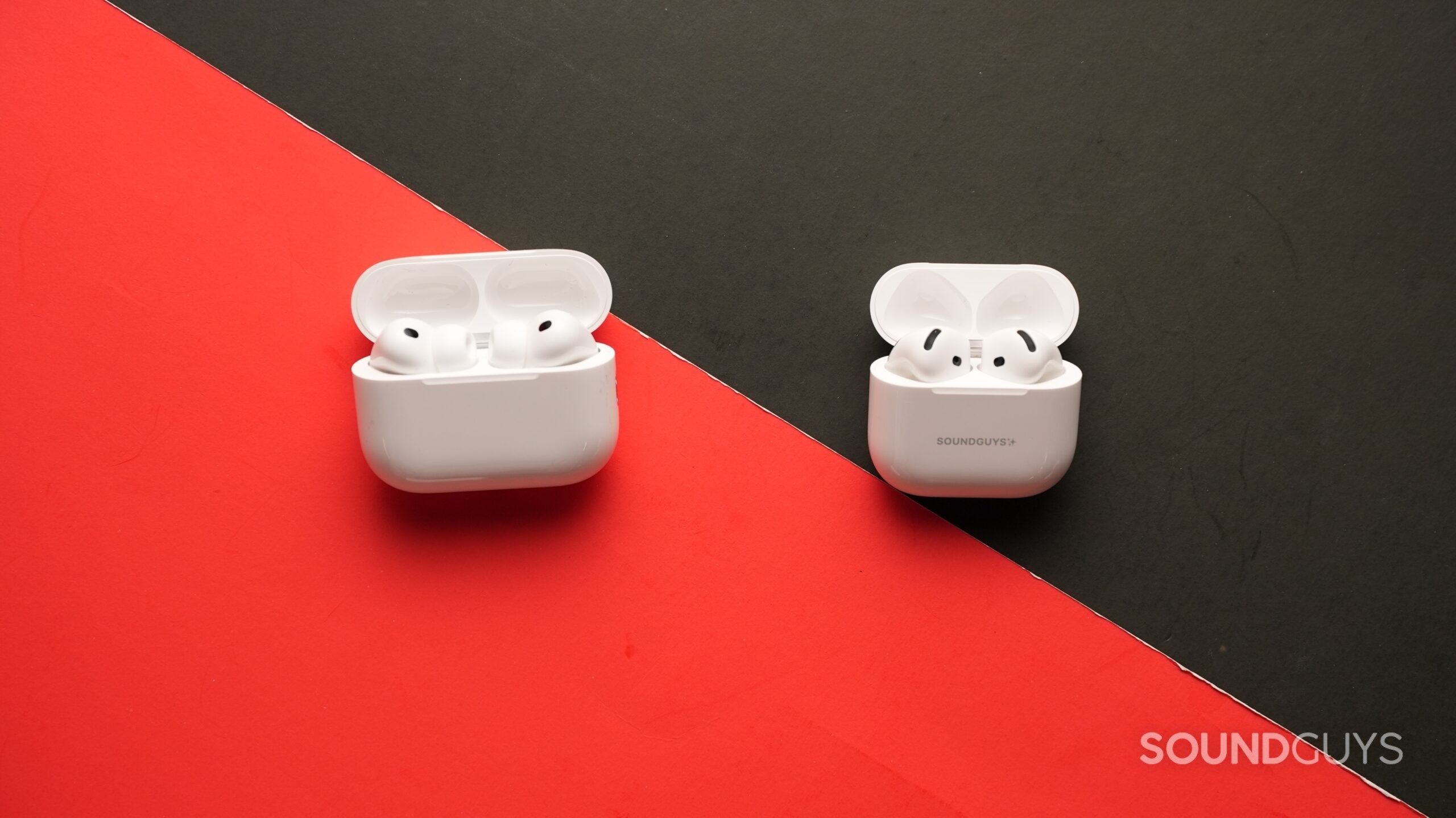 The AirPods Pro 3 and AirPods 4 sit on a table. Each right earbud sits in the centre.