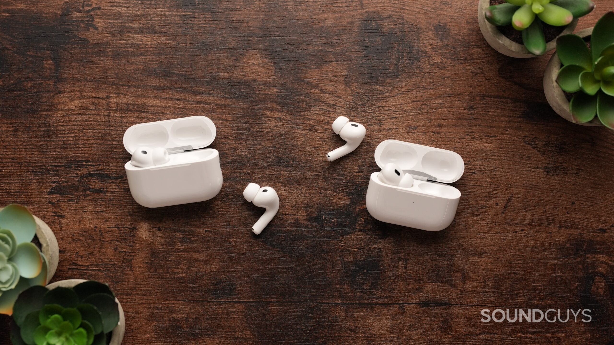 The AirPods Pro 3 and AirPods Pro 2 sit on a table. Each right earbud sits in the centre.