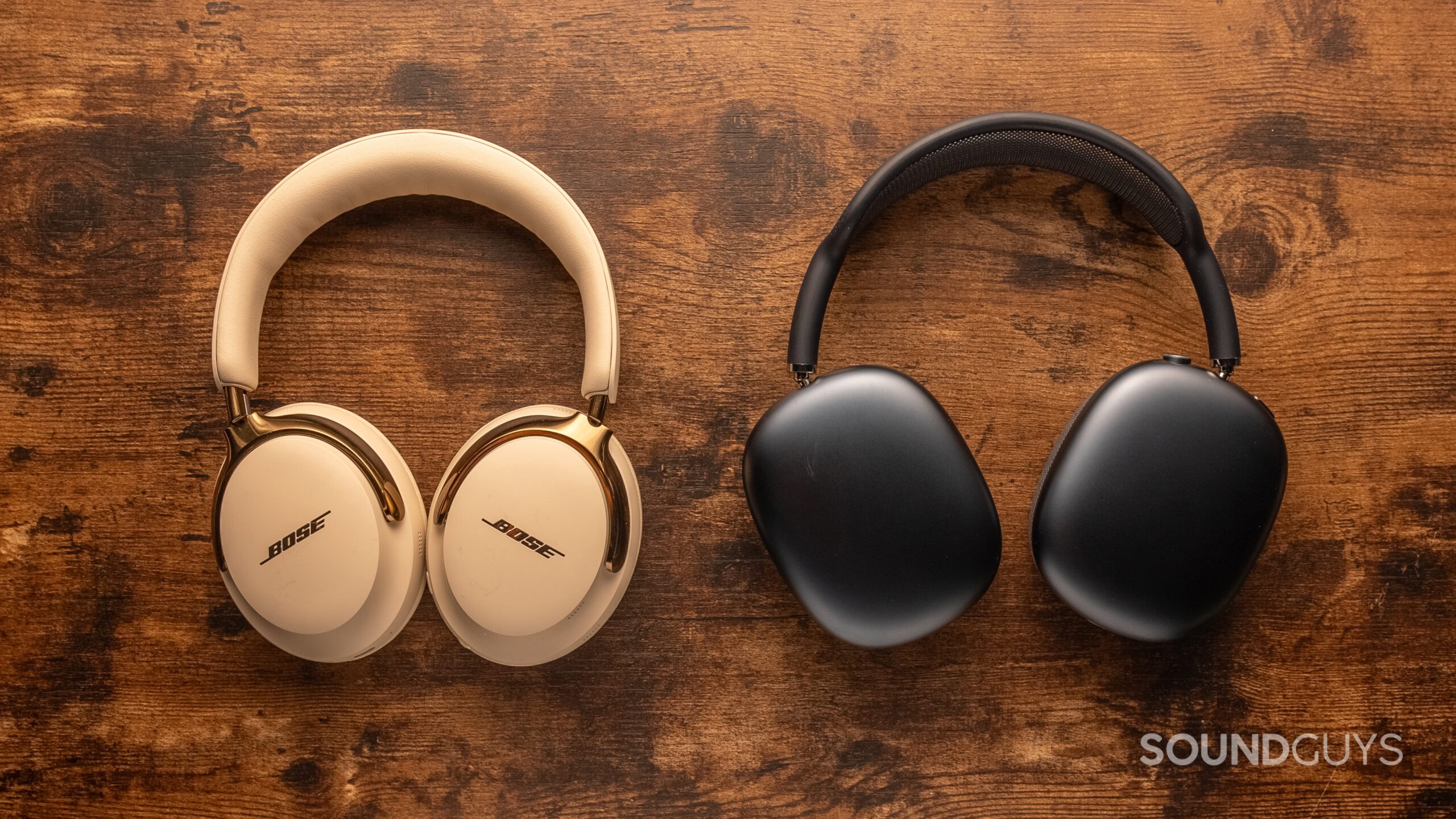 Bose QuietComfort Ultra 2nd gen headphones next to the Apple AirPods Max on a table.
