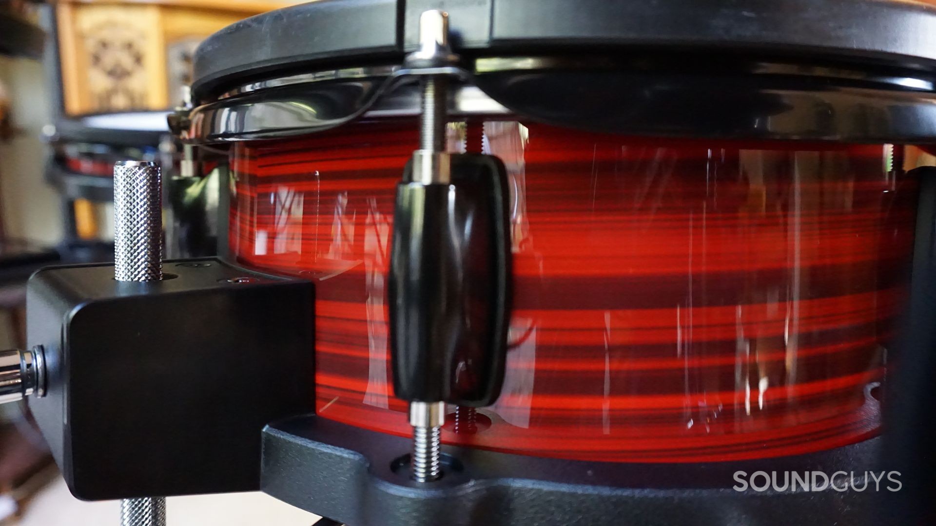 Alesis-Nitro-Ultimate-Red-Lacquer A photograph of the Alesis Nitro Ultimate snare drum tension rods.