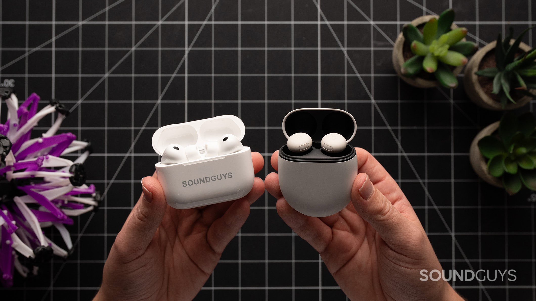 A hand holds the AirPods Pro 3 and Google Pixel Buds Pro 2.