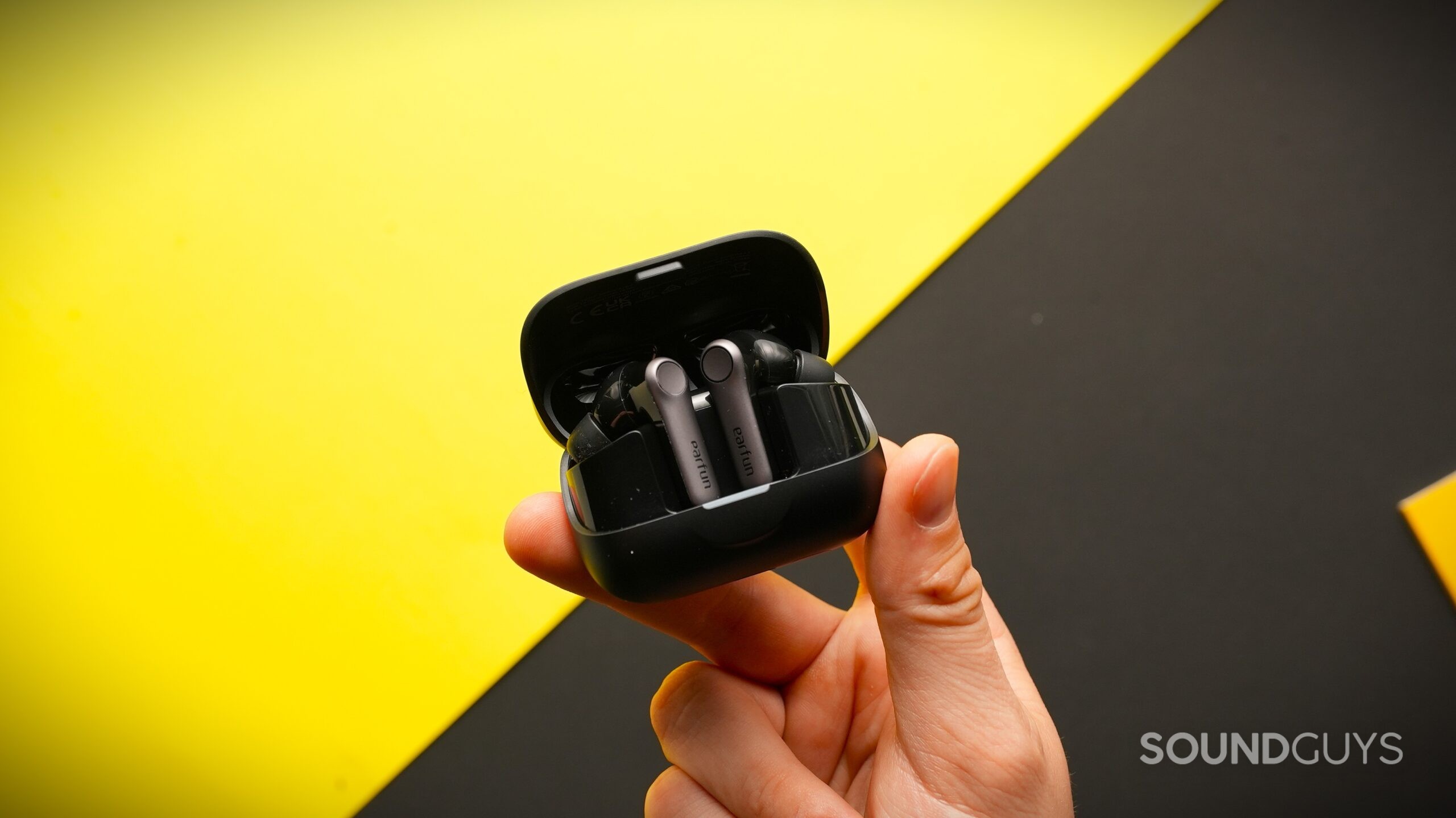 EarFun Air Pro 4+ earbuds in case A hand holds the EarFun Air Pro 4+ earbuds in their case.