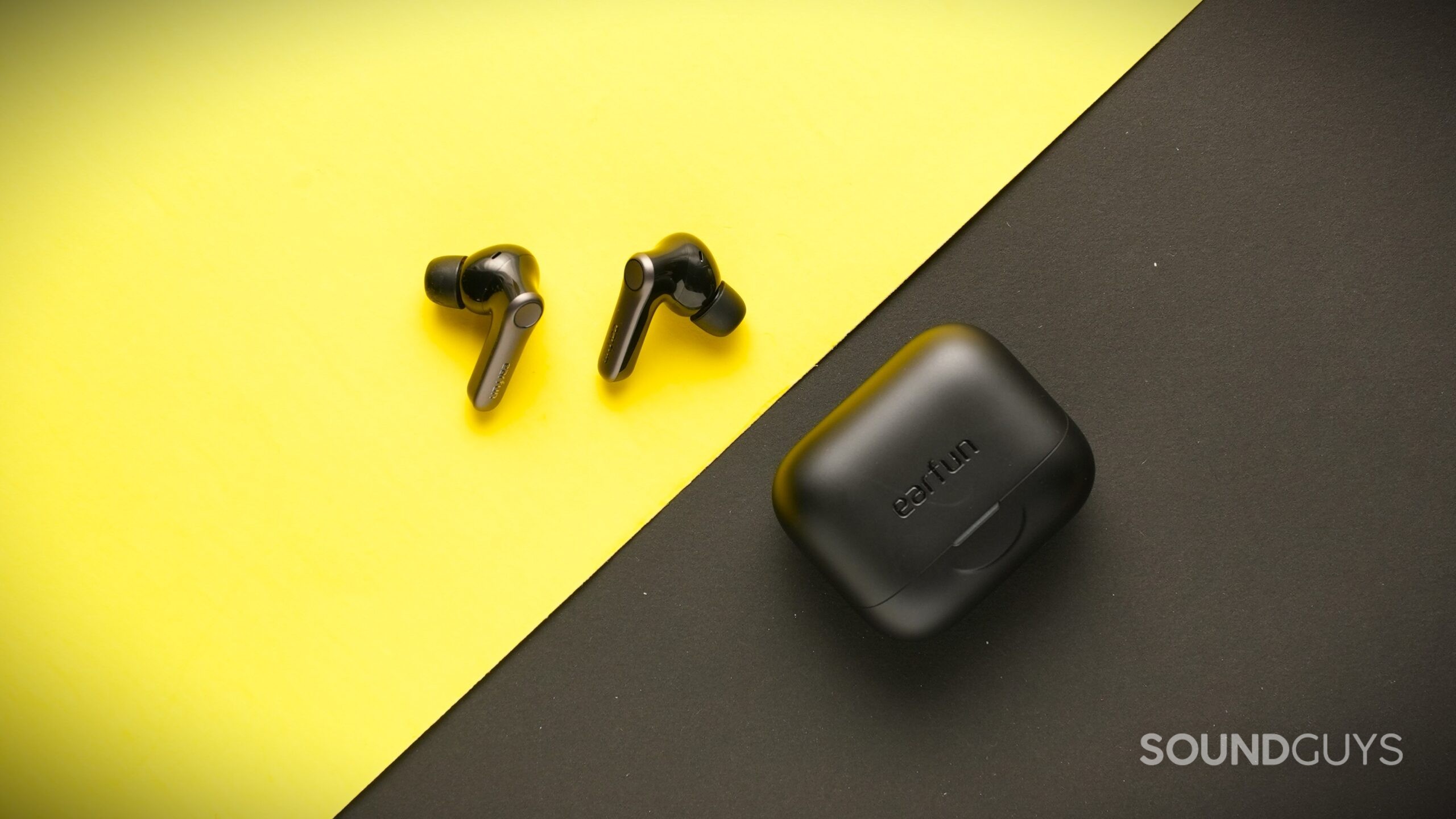 EarFun Air Pro 4+ earbuds next to case. EarFun Air Pro 4+ earbuds next to case.