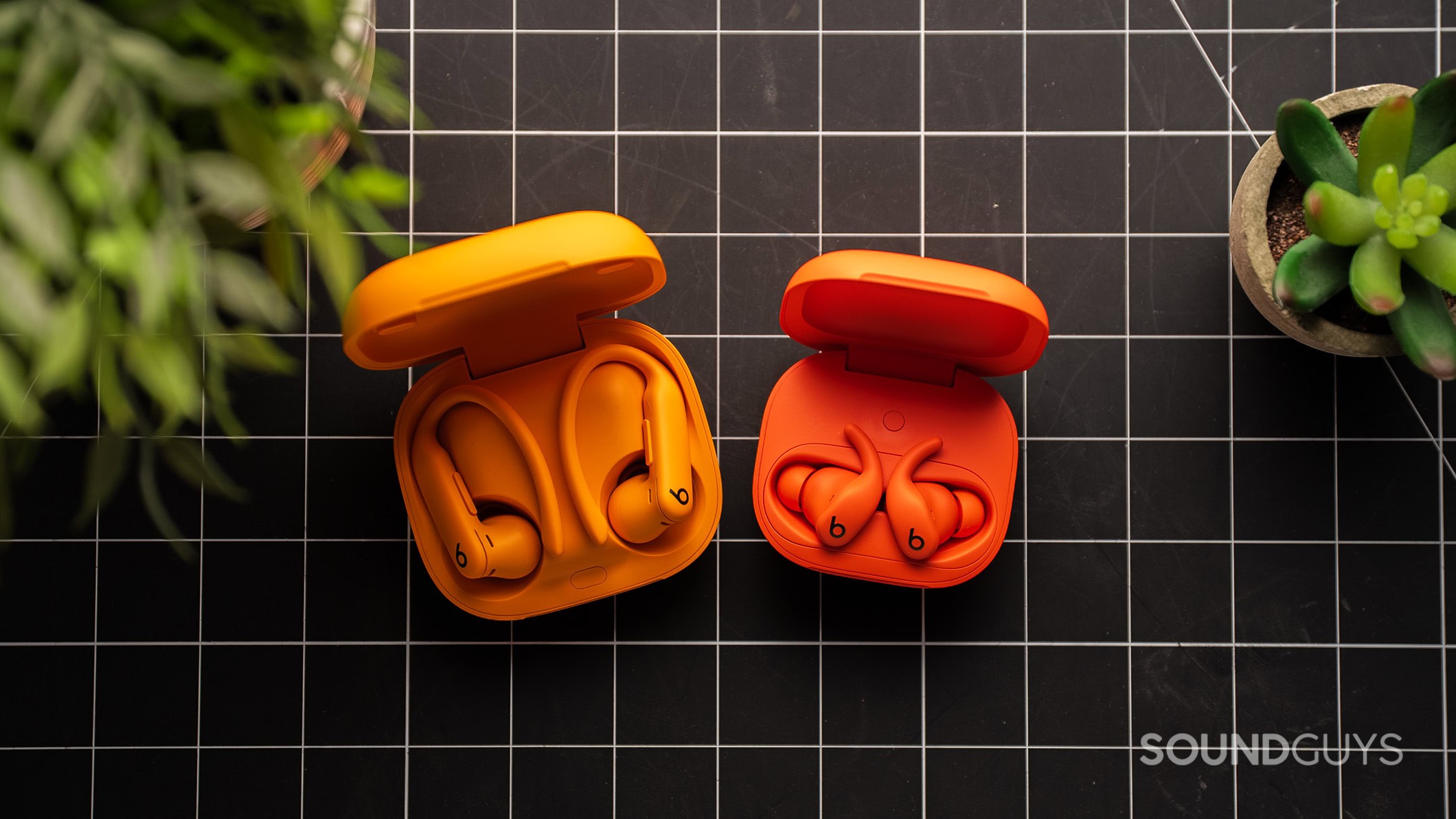 Powerbeats Fit vs Powerbeats Pro 2 Powerbeats Fit next to the Powerbeats Pro 2.