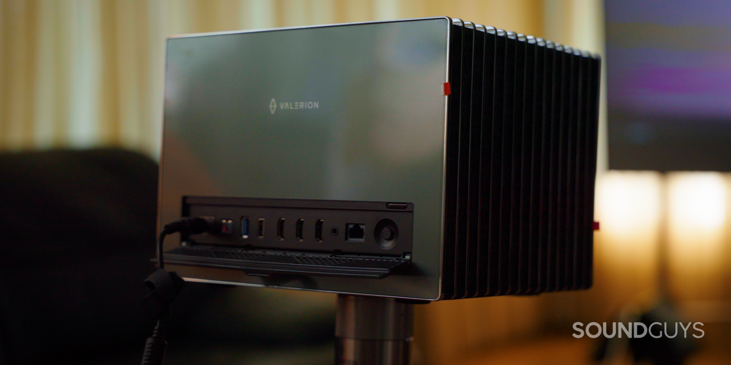 SG_Valerion VisionMaster Pro 2-15 Back inputs and outputs of the Valerion VisionMaster Pro 2 projector on the Valerion Walnut Tripod Stand in living room watching a movie with Valerion 120" Fresnel Ambient Light Rejecting Screen on stands