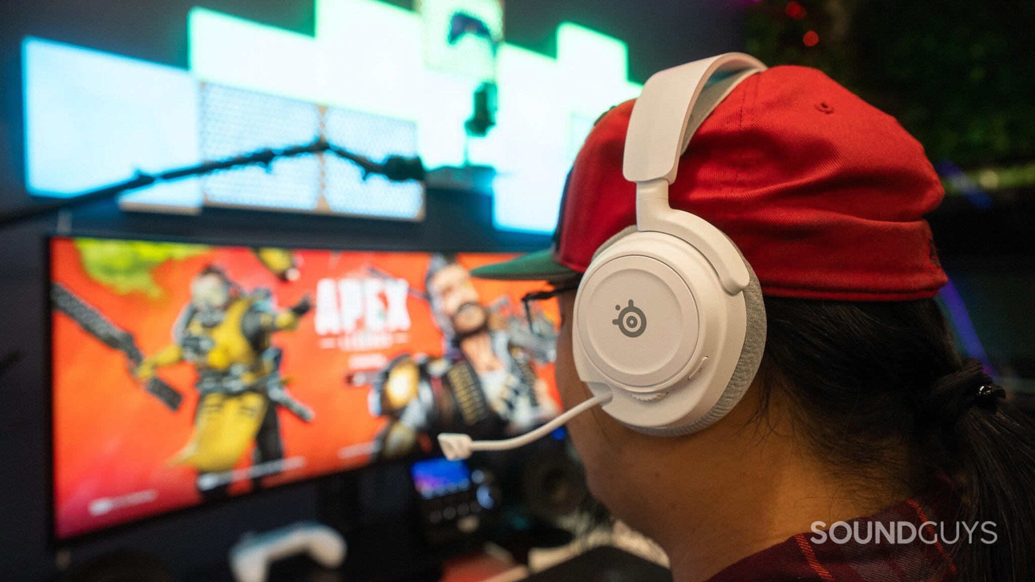 SteelSeries Arctis Nova 7 Gen 2 while gaming SteelSeries Arctis Nova 7 Gen 2 boom mic out and gaming at a desk.