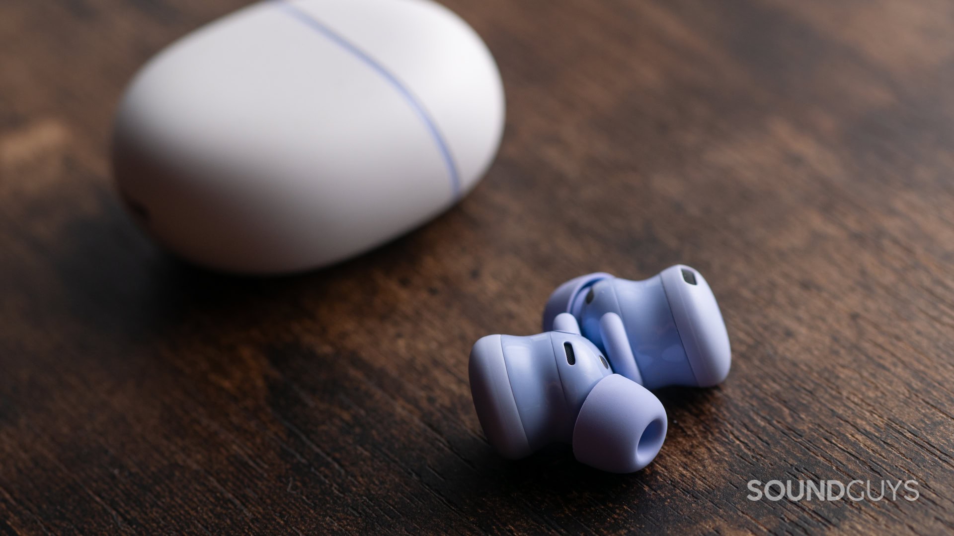 A photo of the Google Pixel Buds 2a with the earbuds out of the charging case.