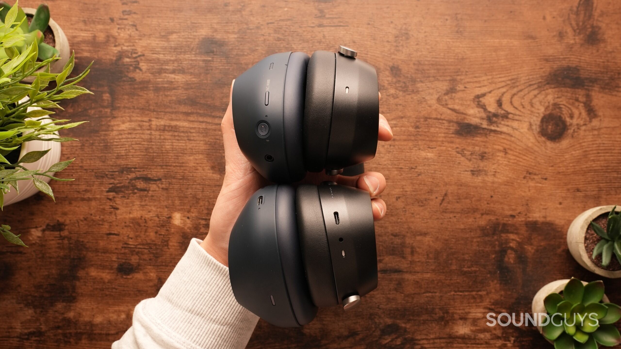 The Sony WH-1000XM6s and the Sennheiser HDB 630s rest against each other, showing the side profile.