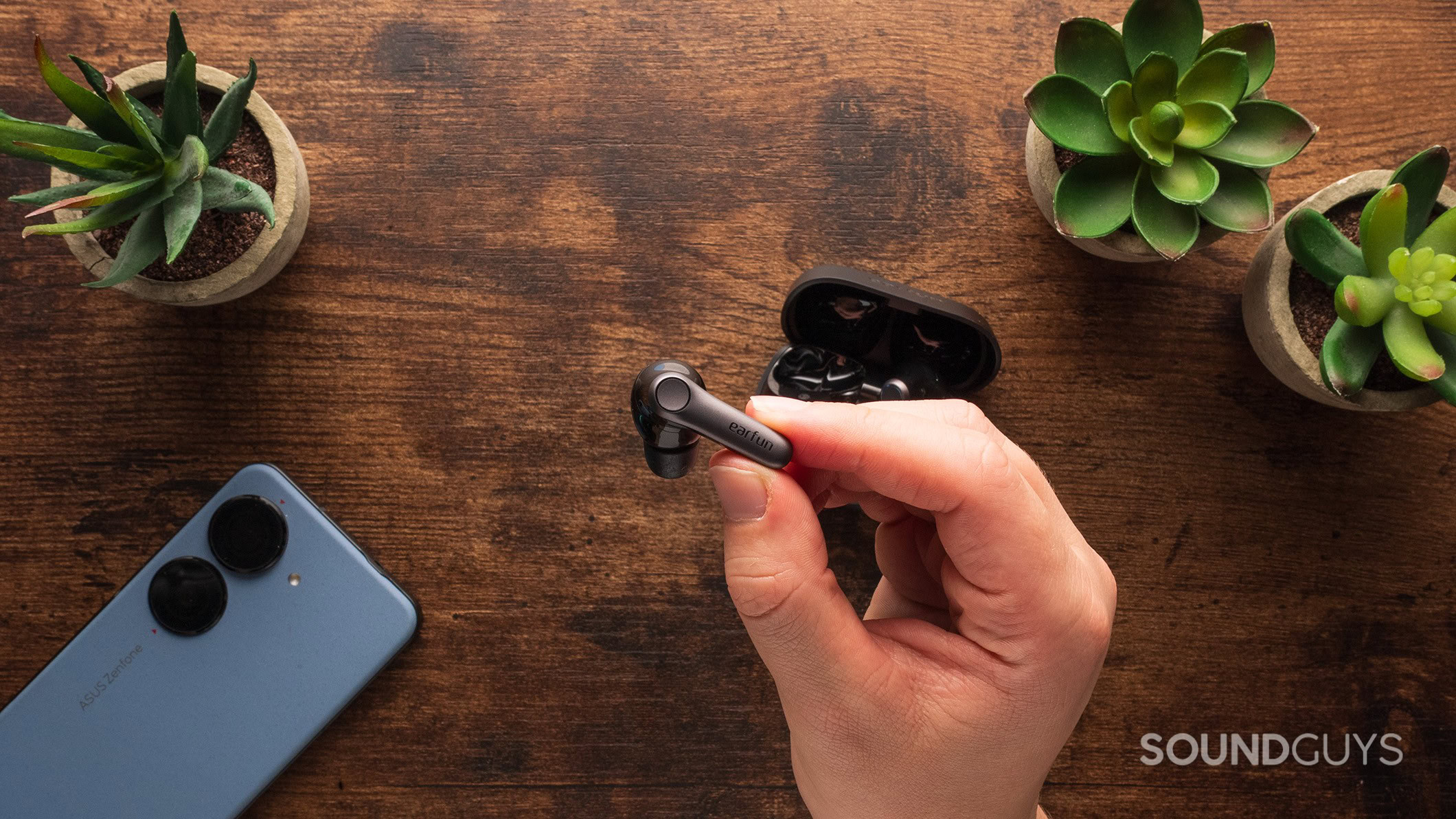 EarFun Air Pro 4 plus earbud held in hand 2 A hand holds the EarFun Air Pro 4+ earbuds.