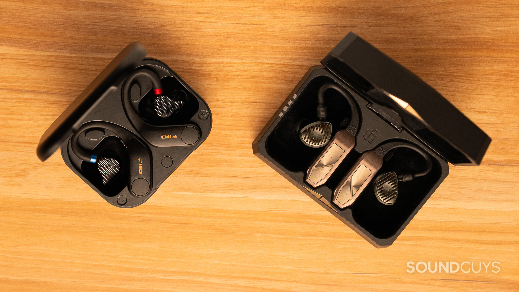wireless bluetooth adapters in their case, to the left and right of frame
