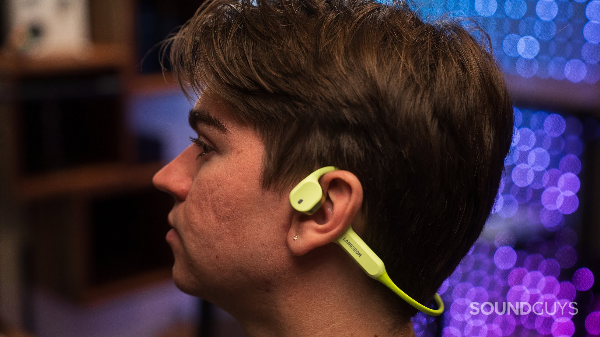 Langsdom AirWave Max headphones on a mans head.