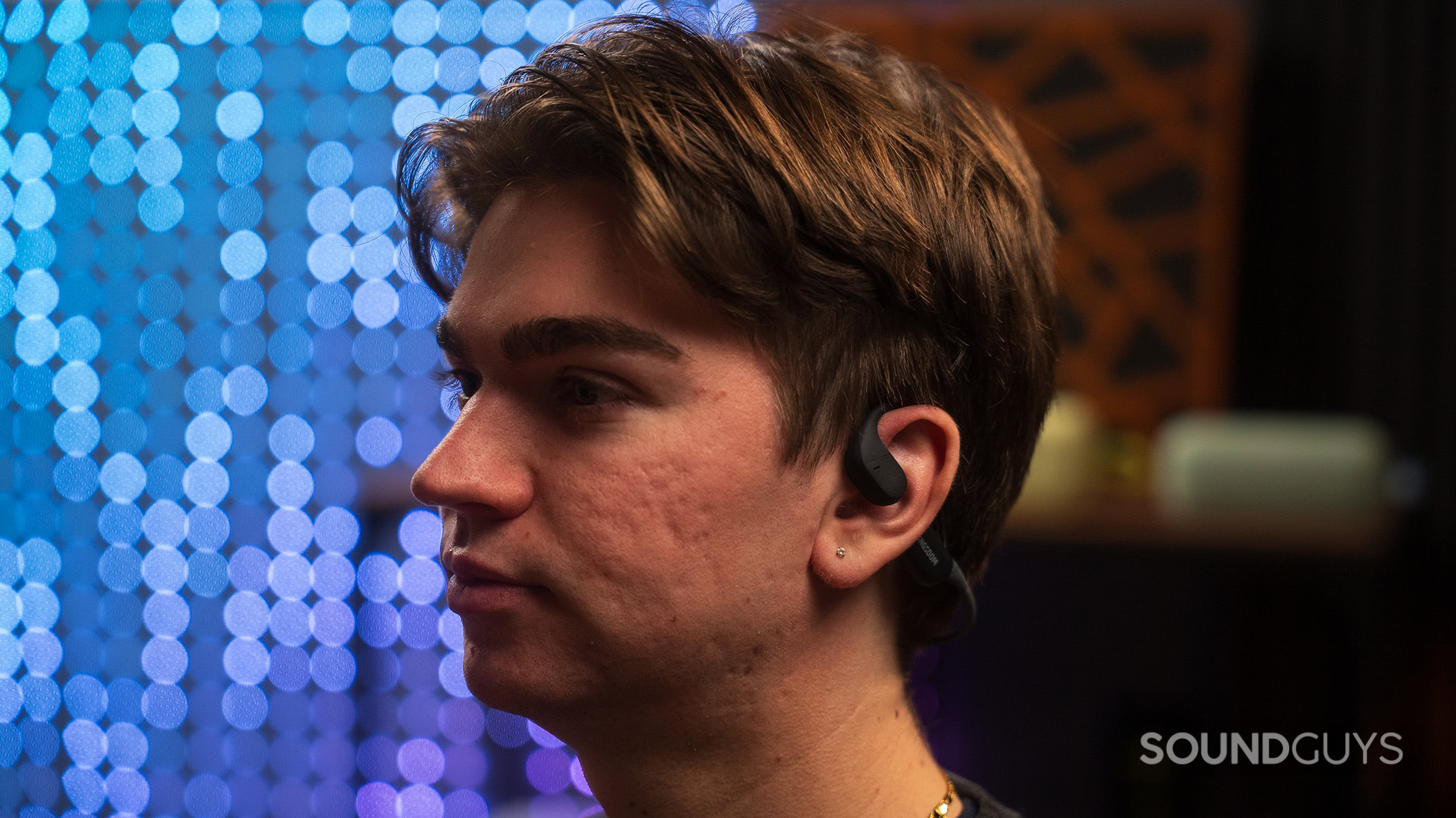 A man wearing the Langsdom AirWave Pro headphones.