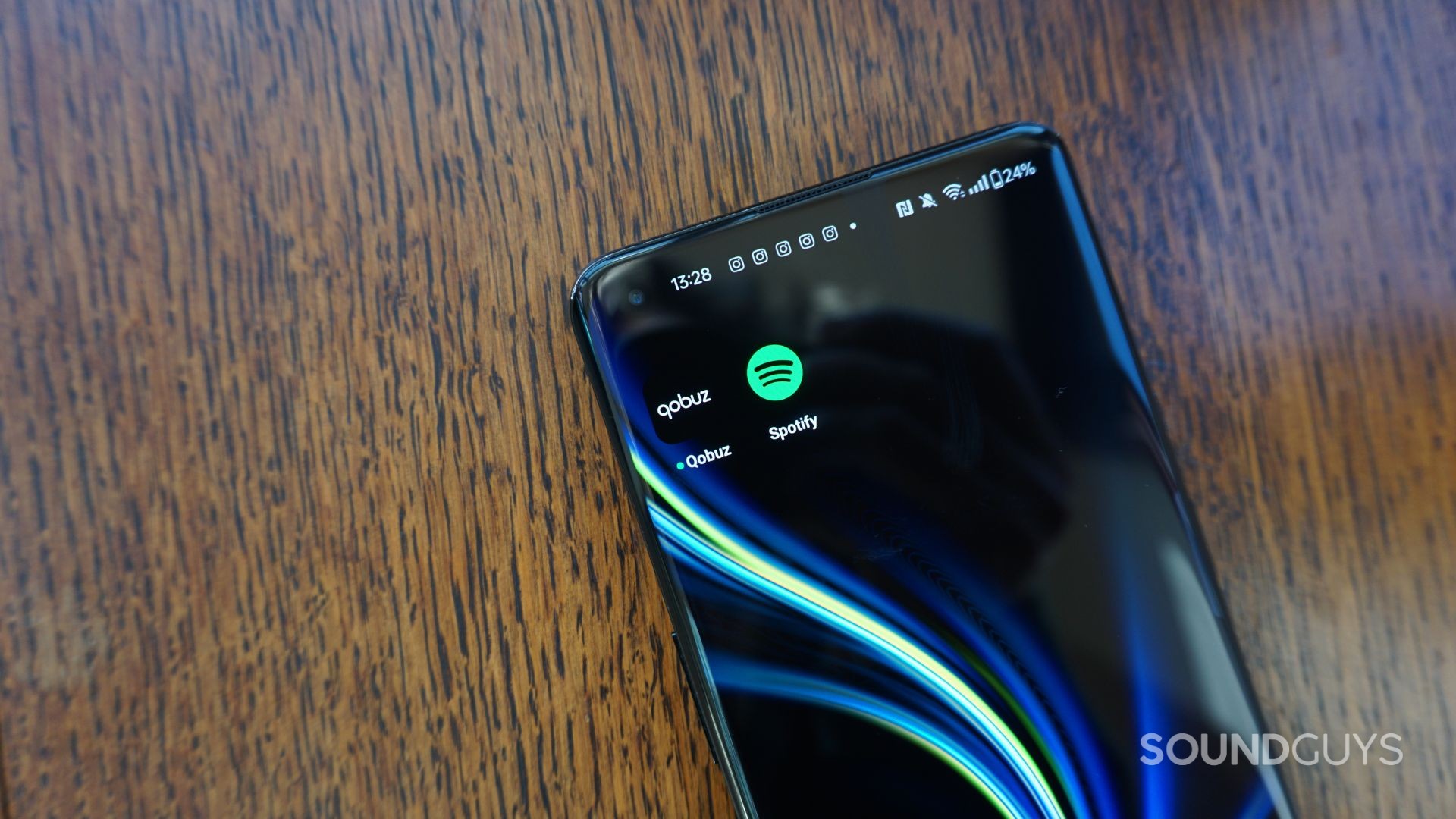 Qobuz-vs-Spotify-Lossless A photograph of the Qobuz and Spotify apps on Android.