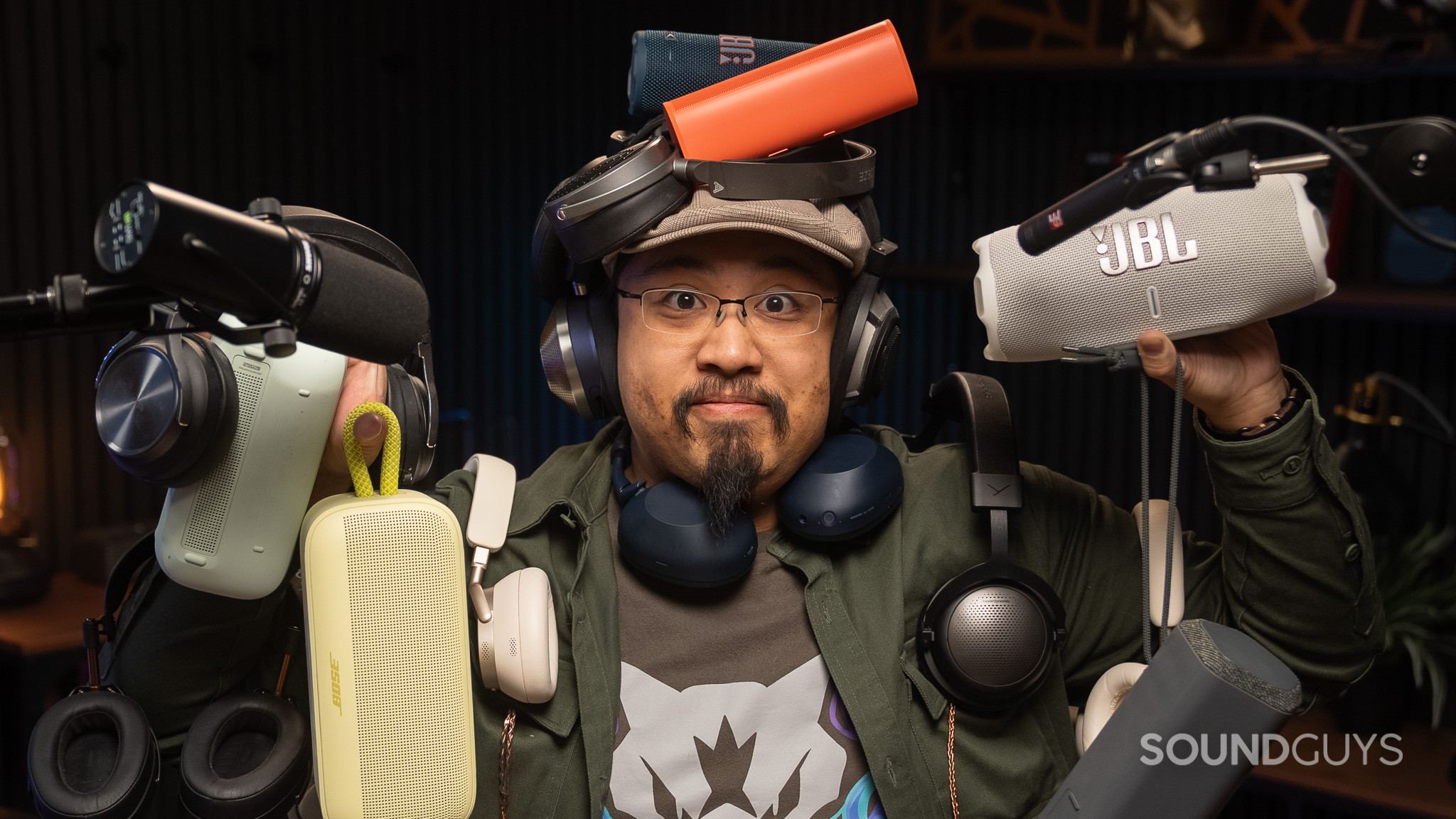 Man inundated with tons of audio equipment.
