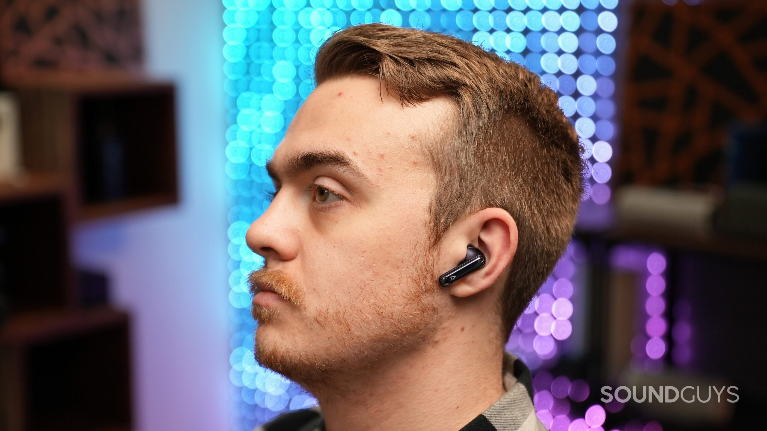 a handsome man wearing the creative auravana ace 3 a handsome man wearing the creative auravana ace 3