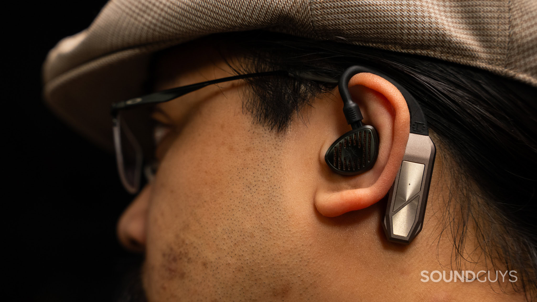 ifi GO Pod Max Worn Man wearing the ifi go pod max bluetooth adapter earhooks.