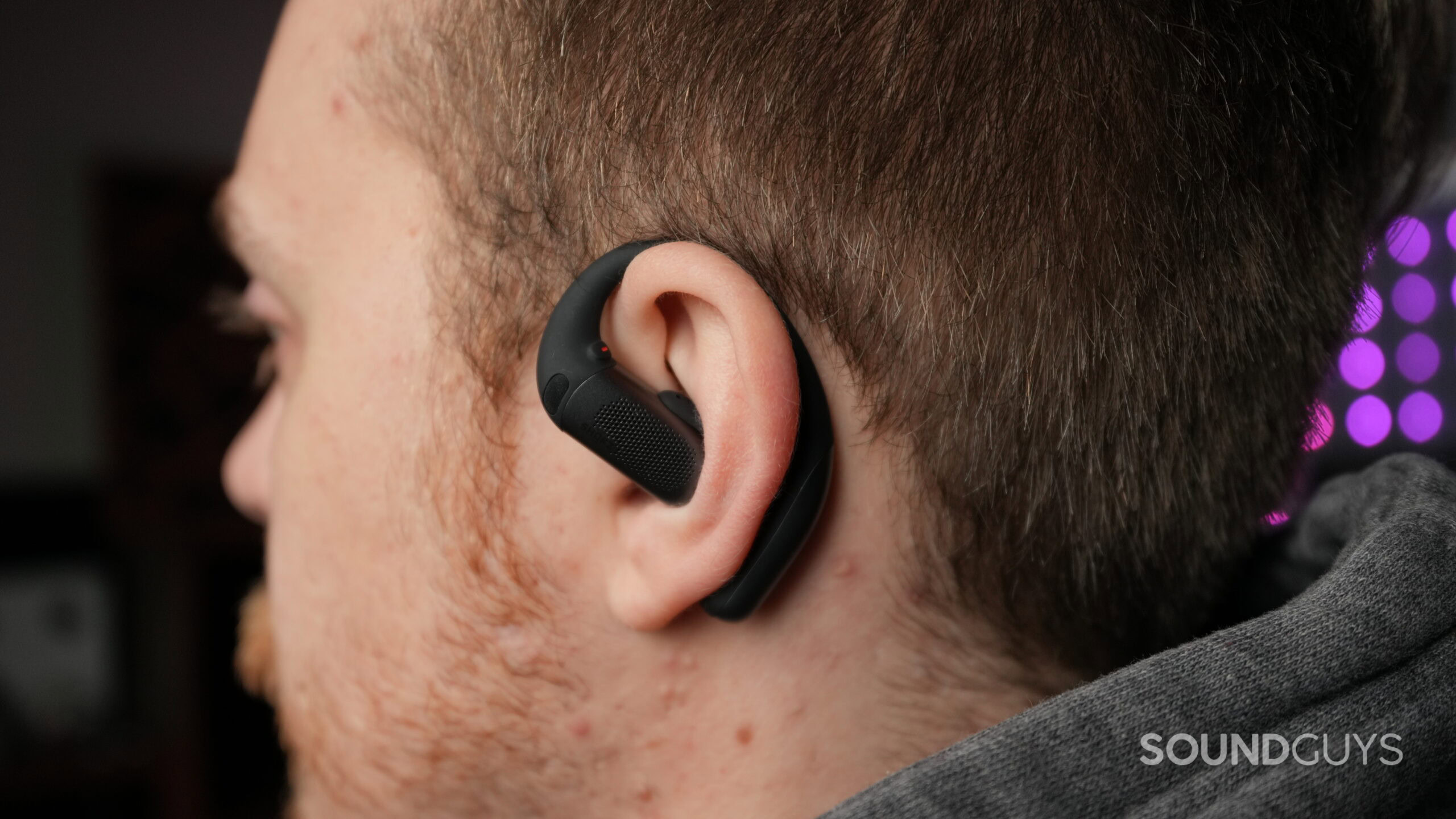 a man wearing the shokz openfit pro