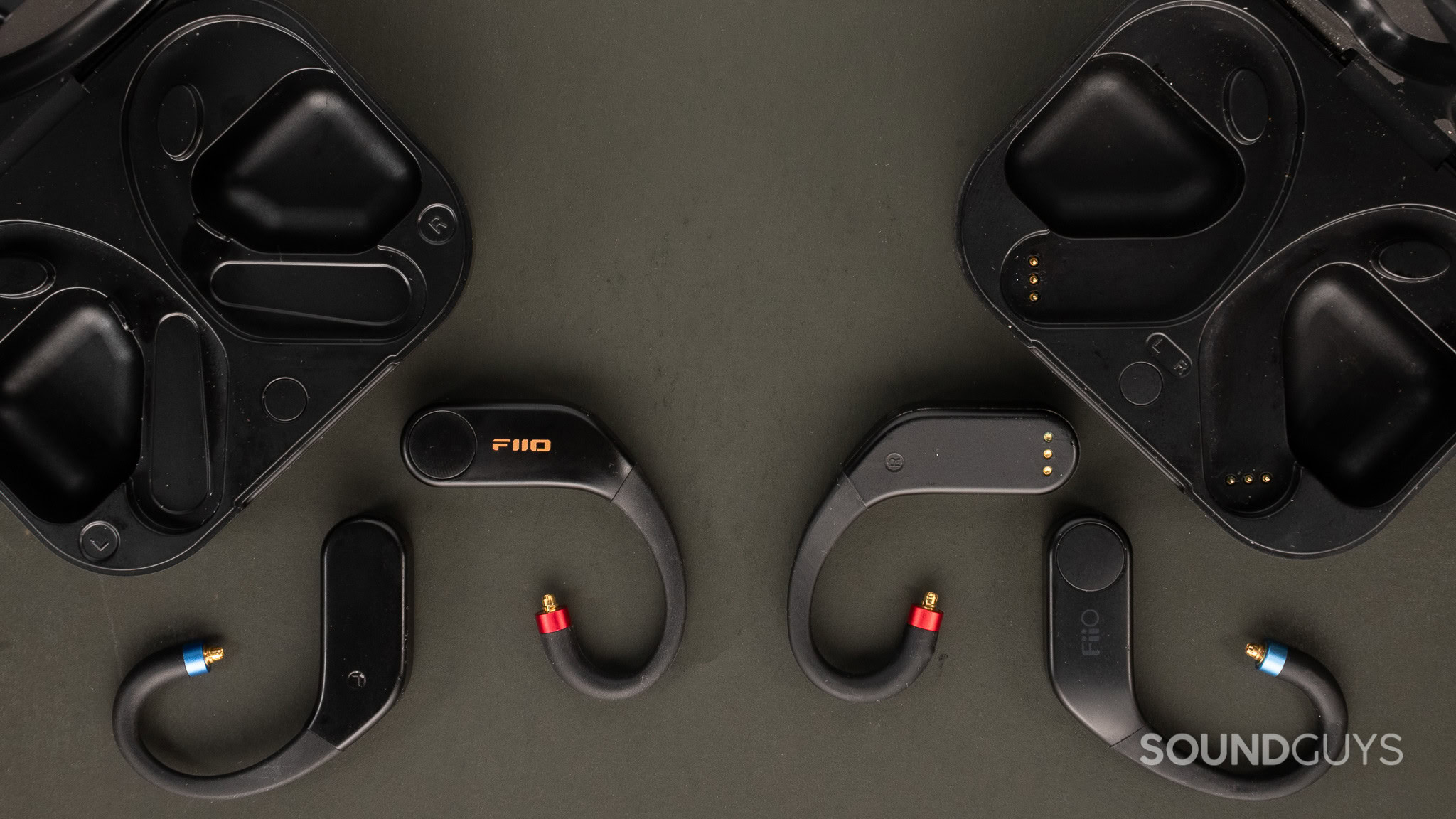 Top down ofFiio UTWS5 charging pads on the left and UTWS charging pins on the right