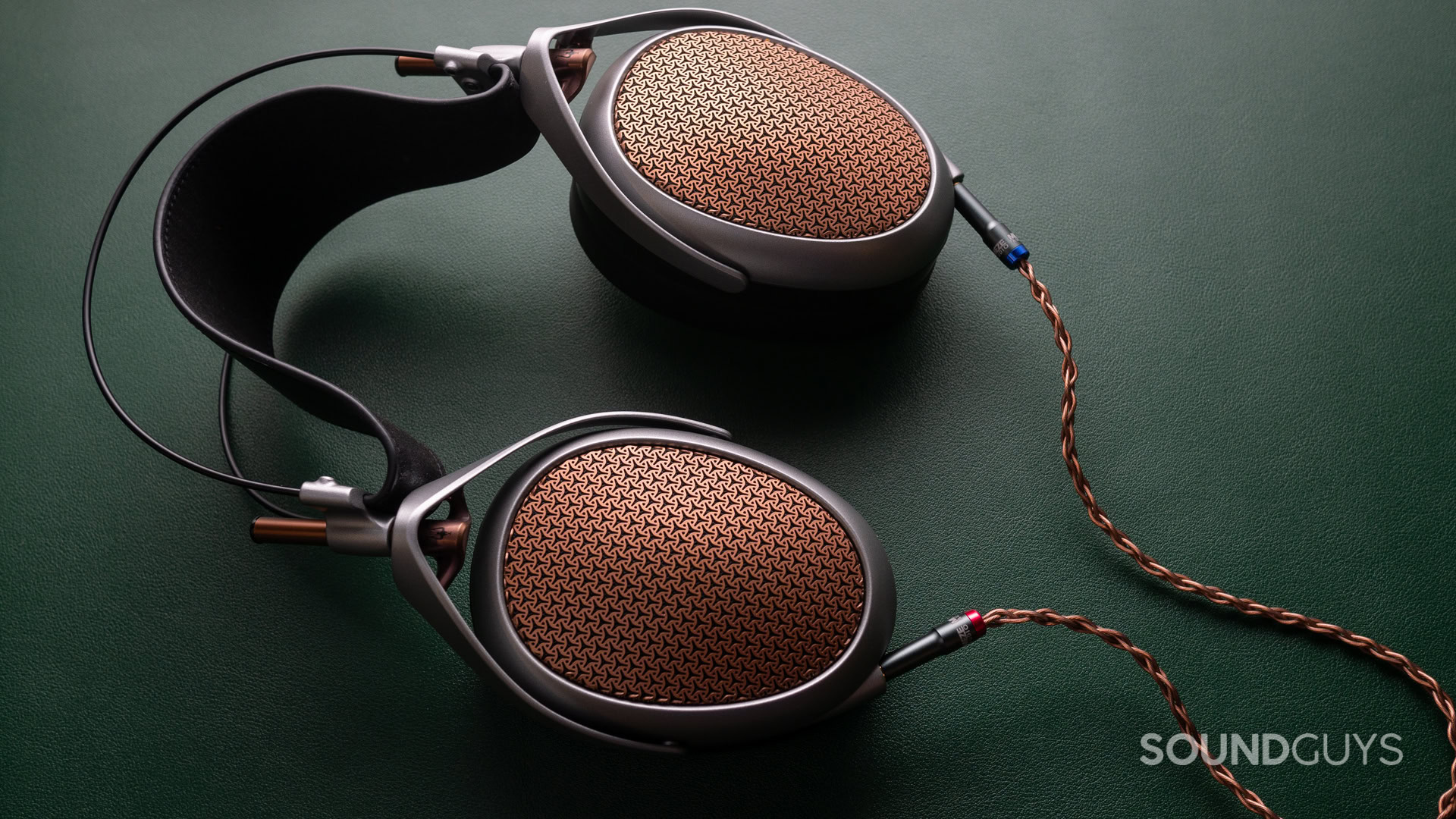 A photo of the Meze Audio Poet with the Y-shaped cable plugged in.