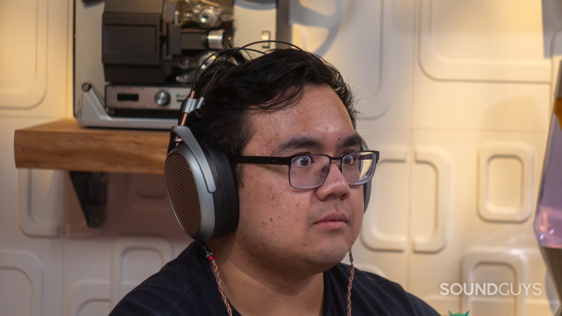 Meze audio poet 012 A man is surprised by the sound of high-end headphones, and not in a good way.