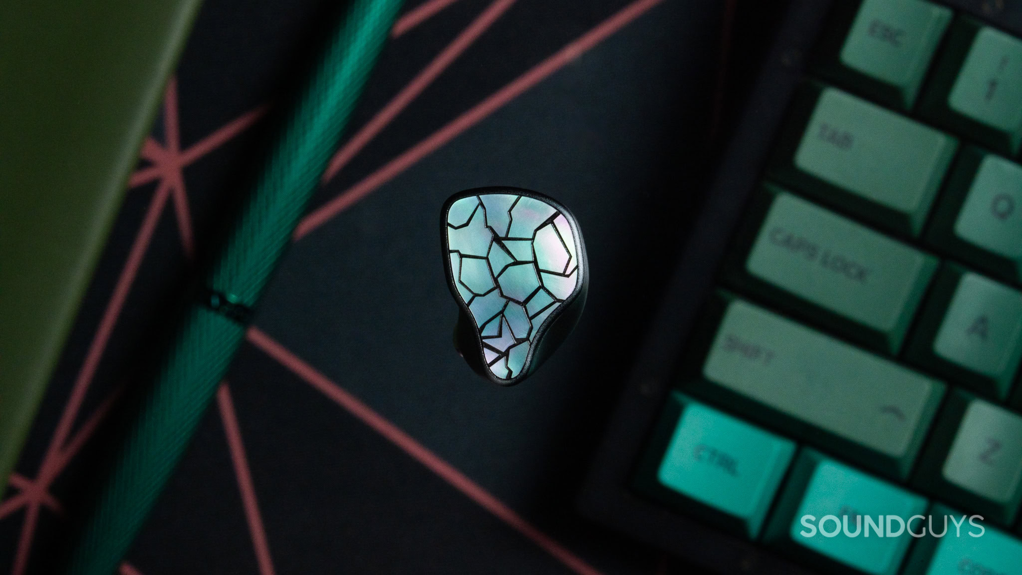 ThieAudio Hype 4 MKII earbud, top down with the side that looks like shattered glass.