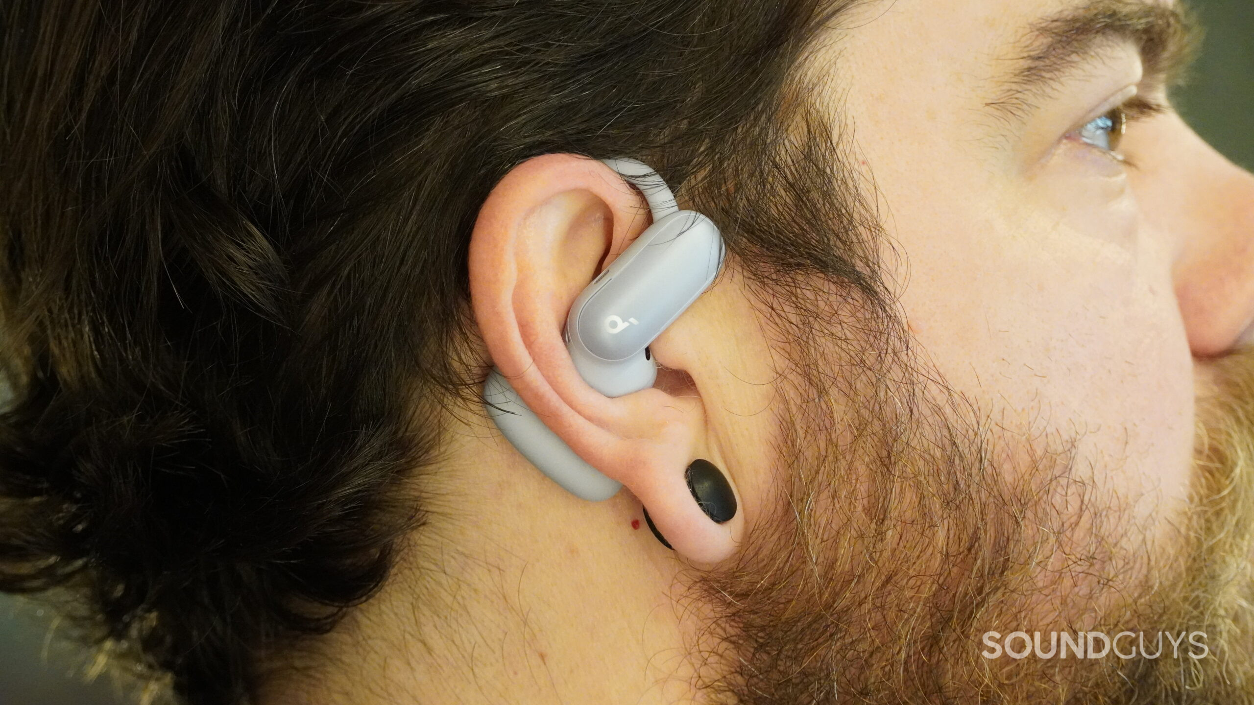 The Soundcore Aerofit 2 Pro in open ear mode, on a man's head.