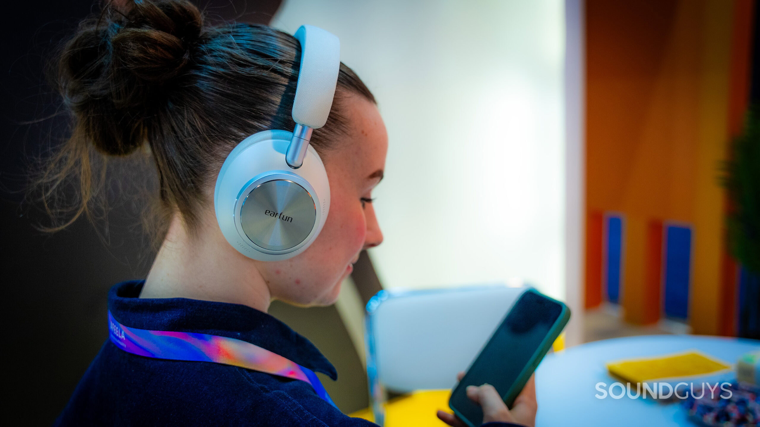 EarFun Wave Pro X side profile A woman wearing the EarFun Wave Pro X headphones.