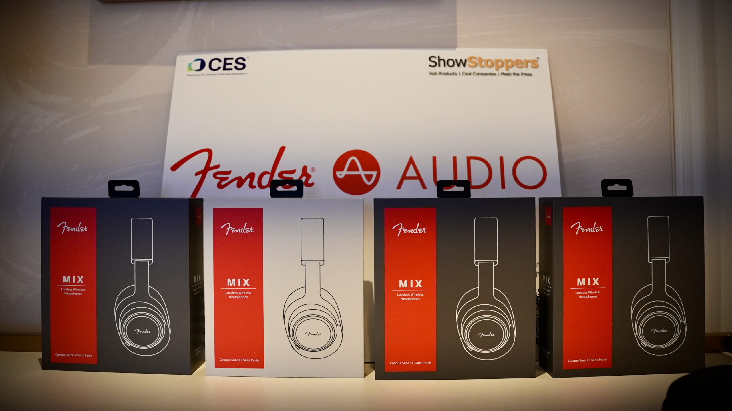 Fender MIX headphones - 1 (2) Four boxes of Fender MIX headphones lined up on a desk at CES 2026.