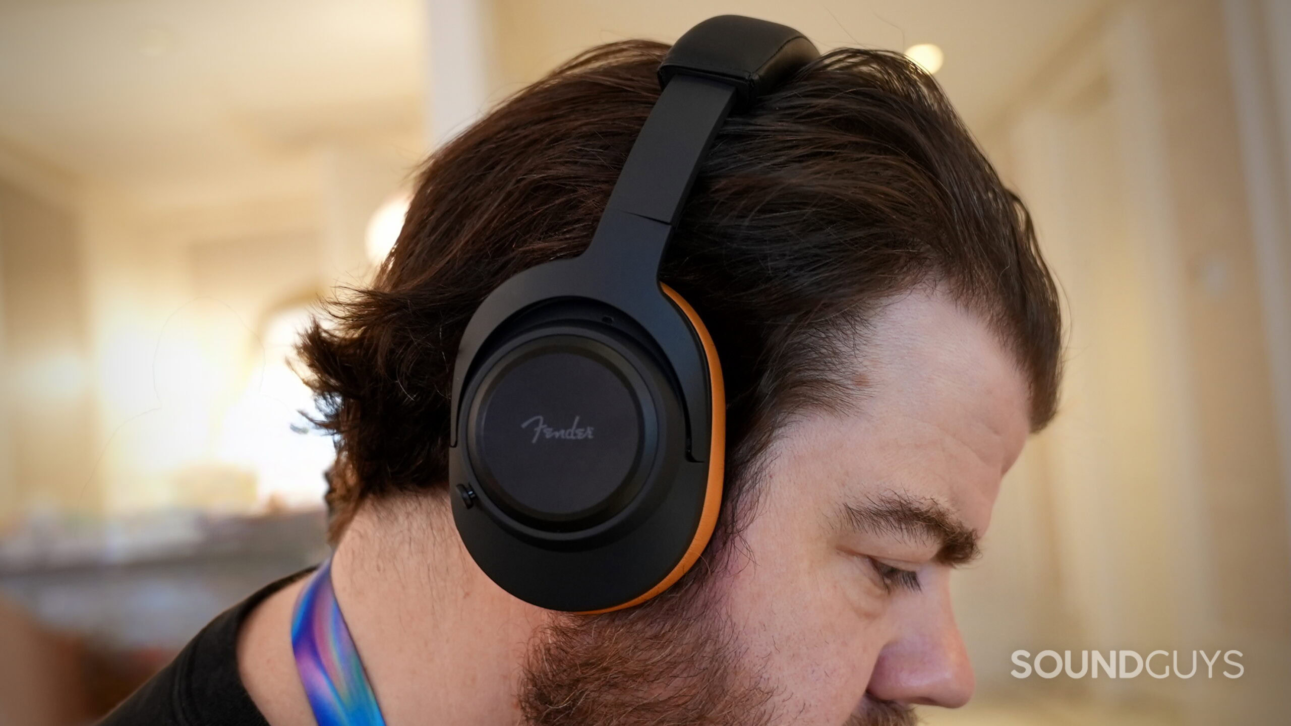 Fender MIX headphones - 1 A man wearing the Fender MIX headphones.