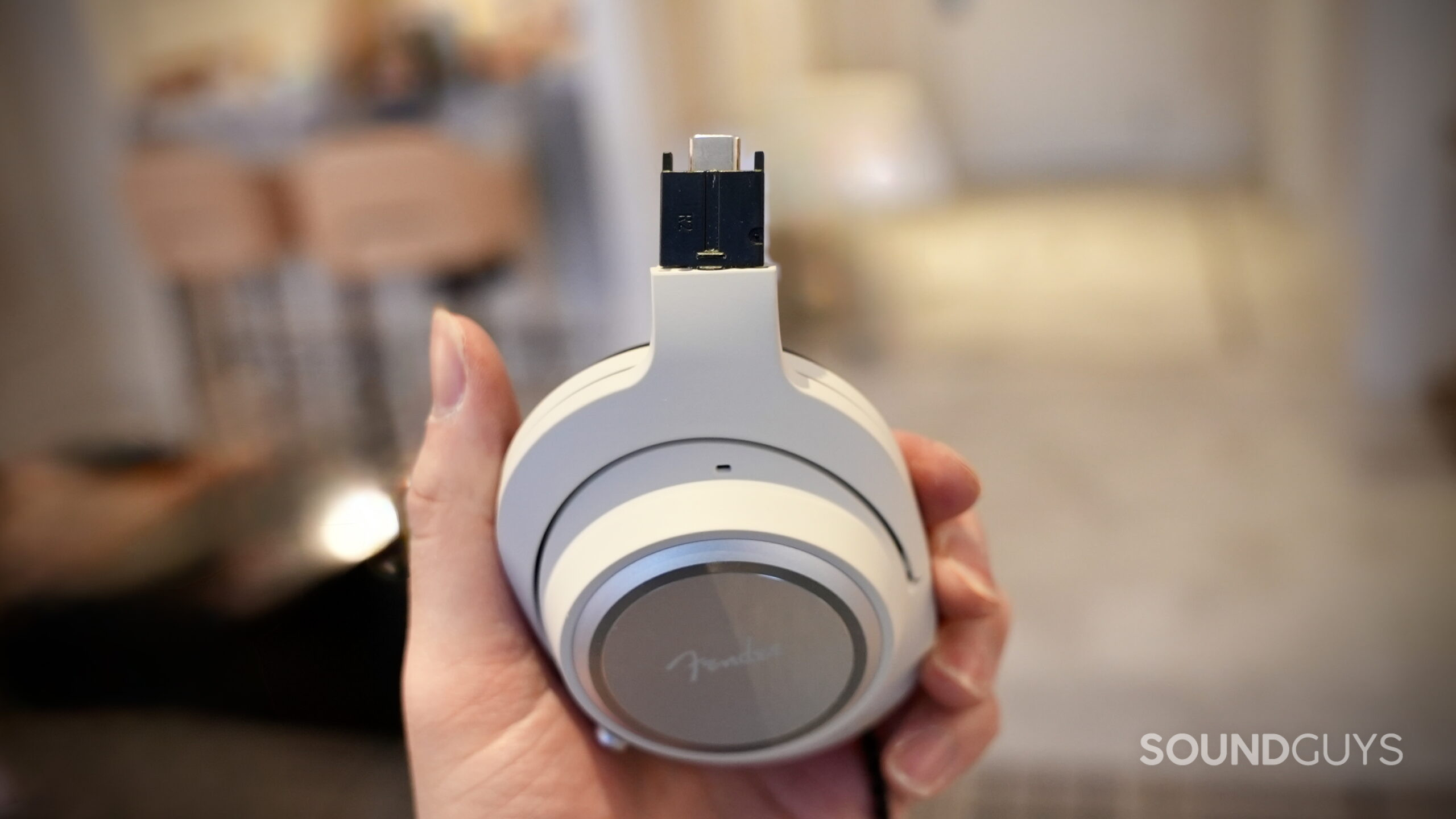 The Fender MIX headphones' driver housing has been removed, revealing its USB-C connection.