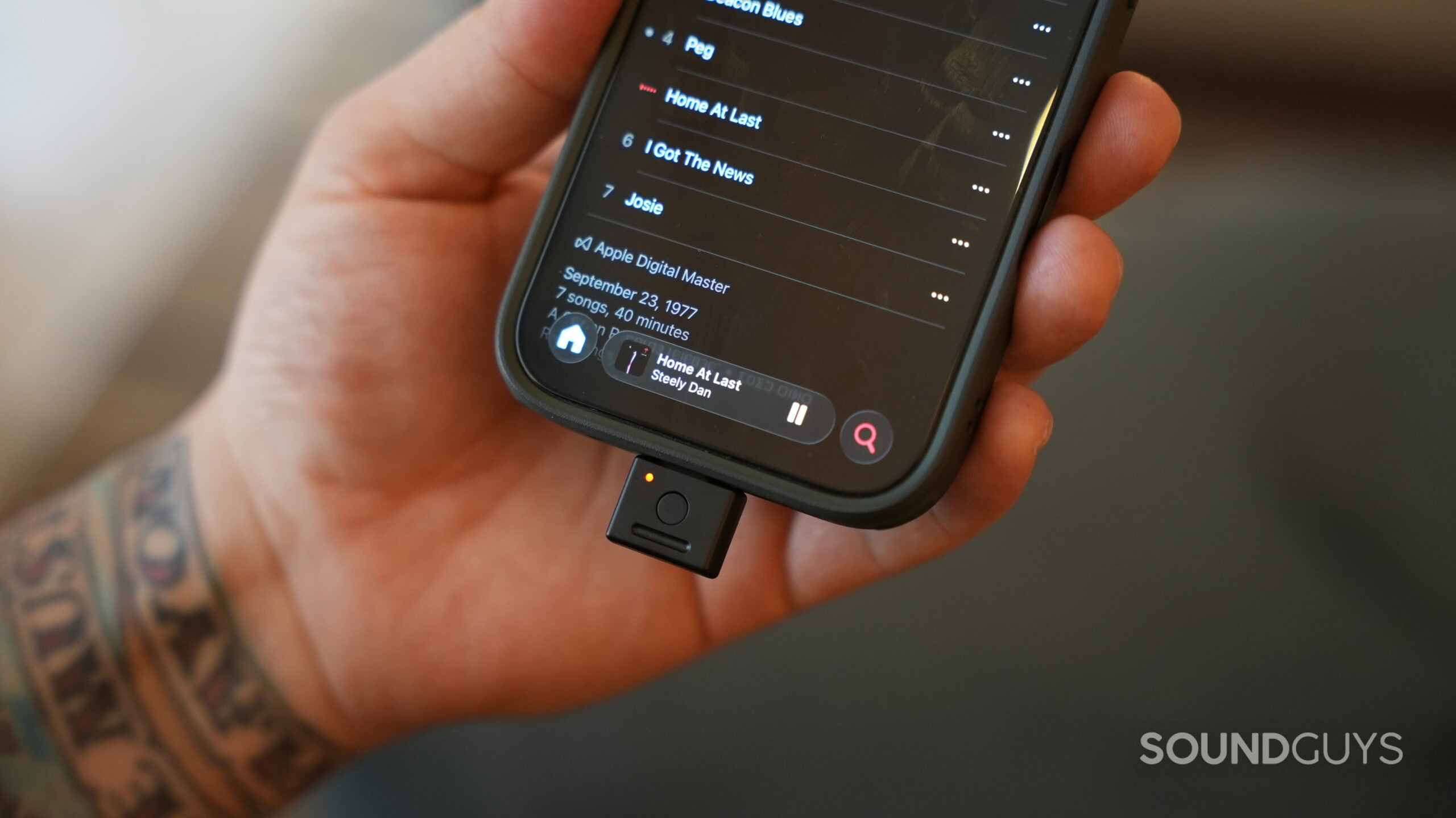 Fender MIX headphones - 5 The Fender MIX dongle attached to an iPhone 16 Pro