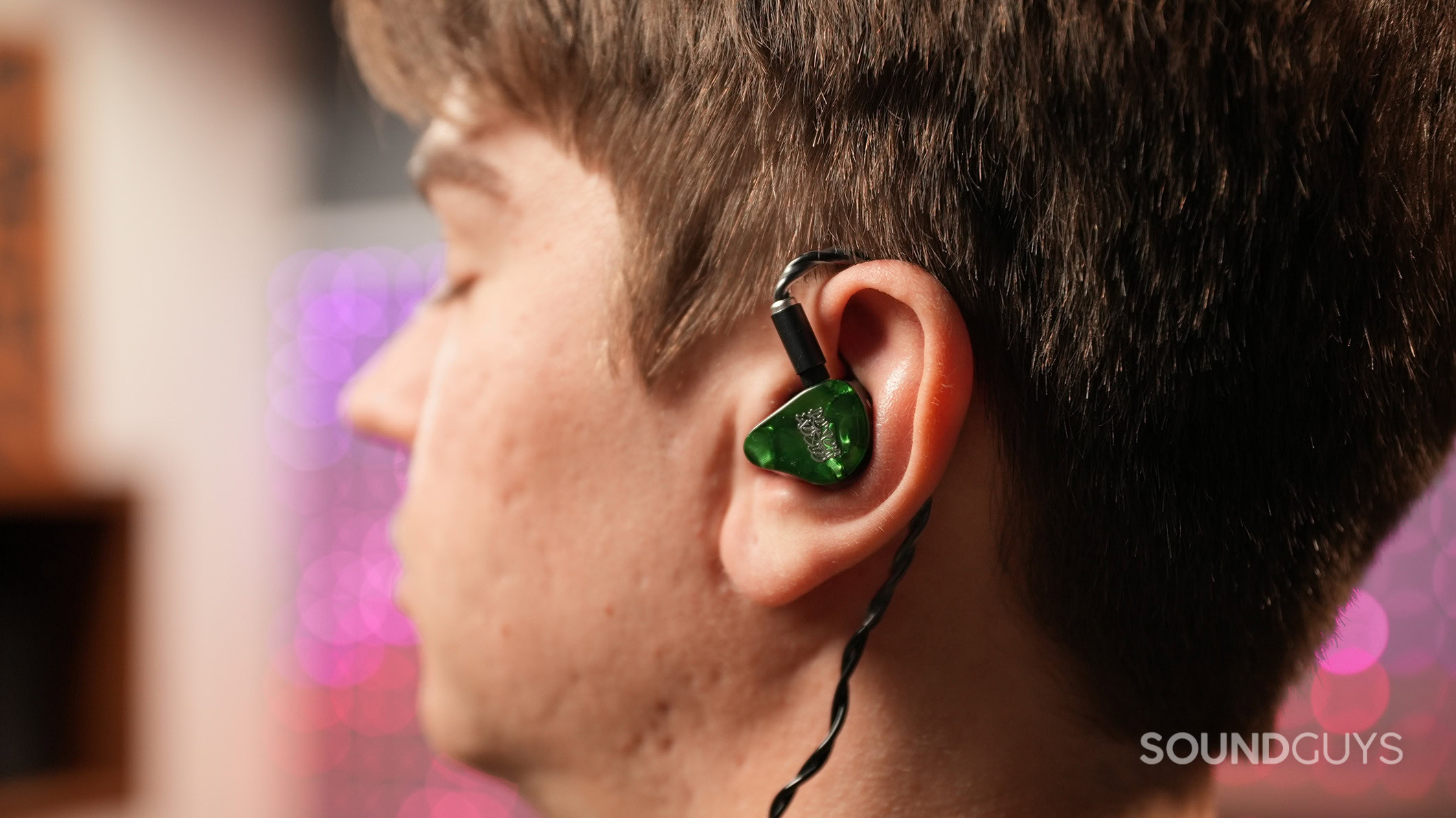 A man wearing the Punch Audio Portazo earphones.