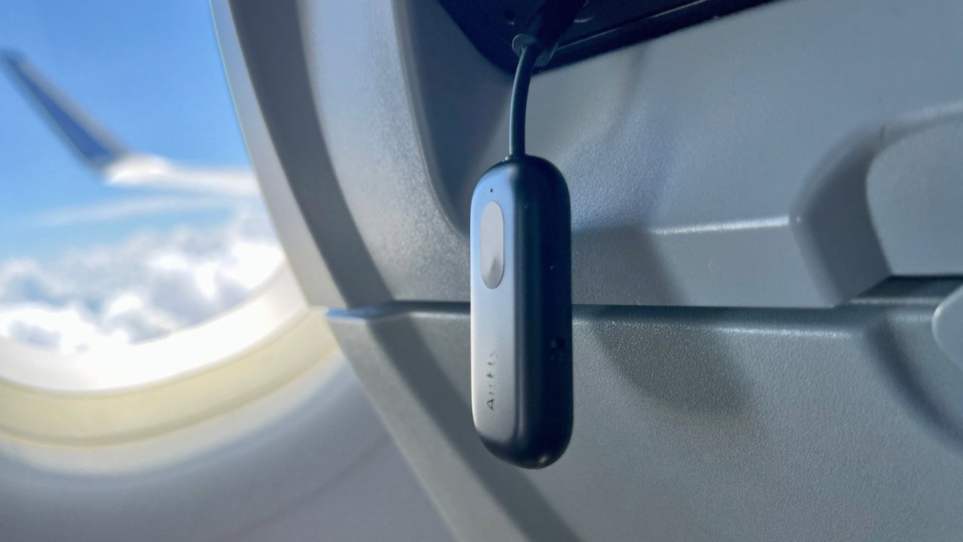 Twelve-South-AirFly-Pro-plugged-into-flight-entertainment-system A photograph of the Twelve South AirFly Pro plugged into a flight entertainment system.