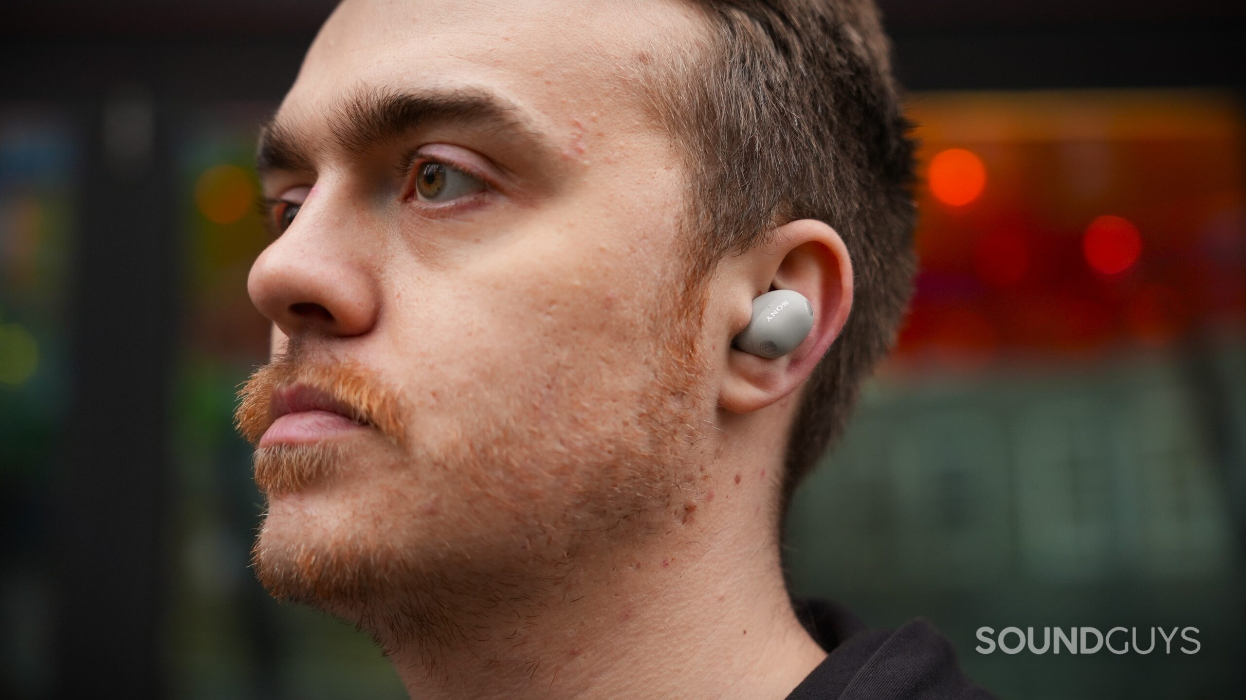 a man wearing the sony wf-1000xm6 earbuds