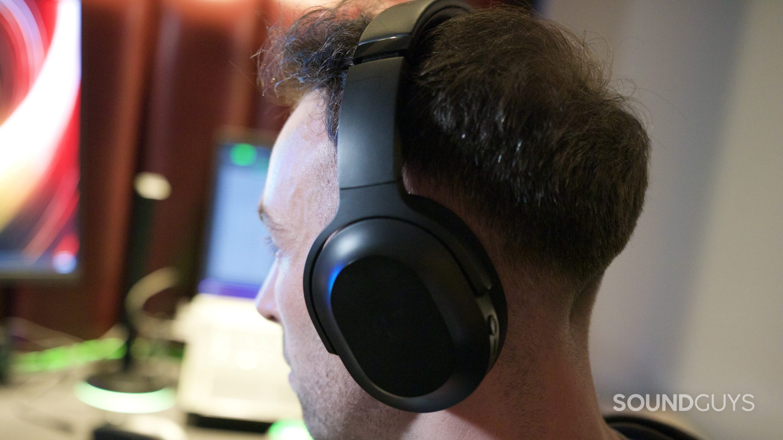 a man wearing the razer motoko headphones