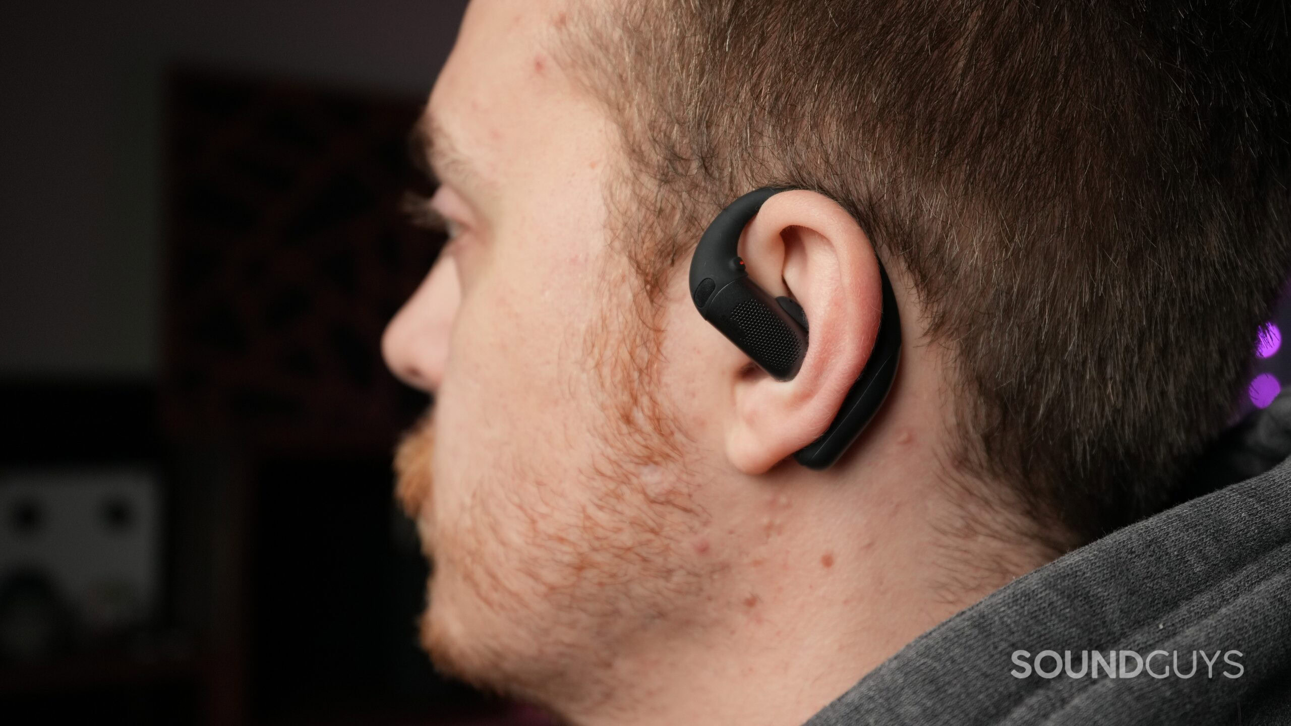 a man wearing the shokz openfit pro