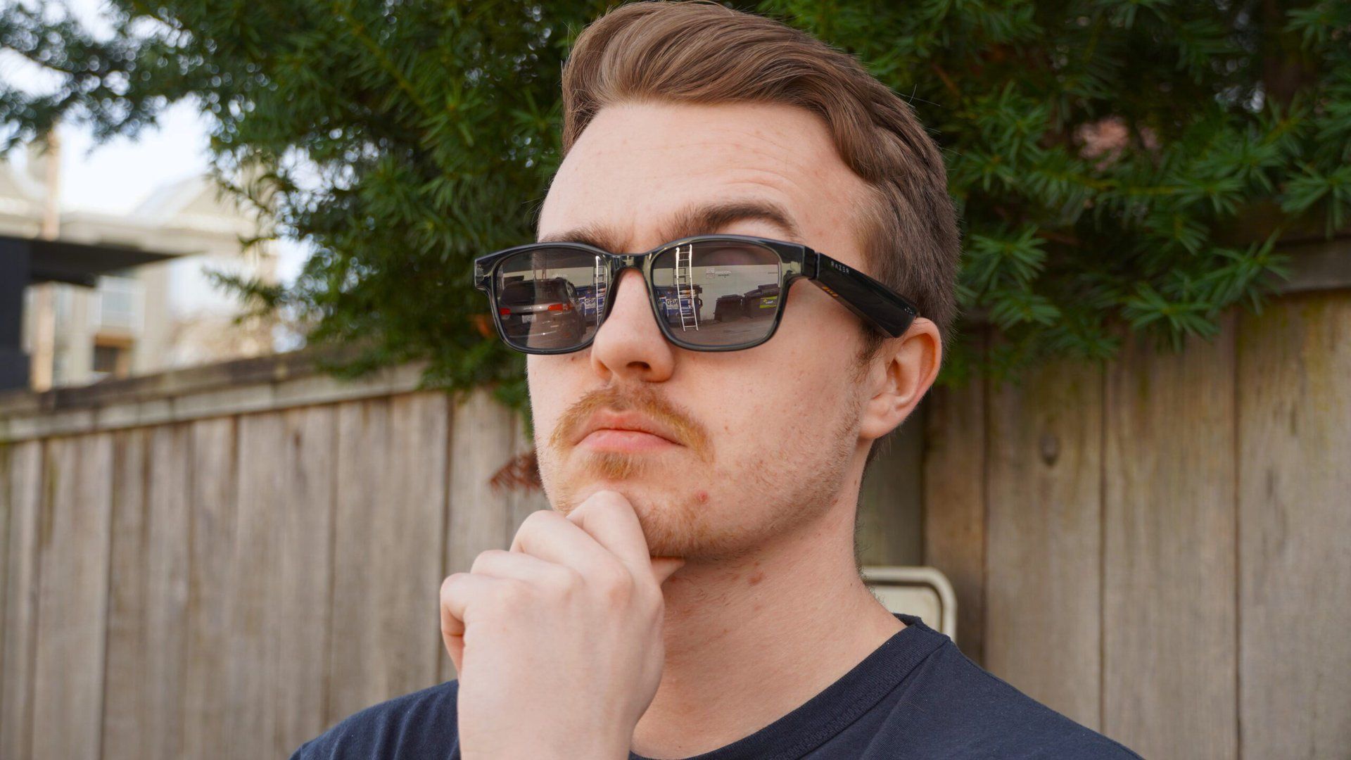 A photograph of a man wearing XR glasses.