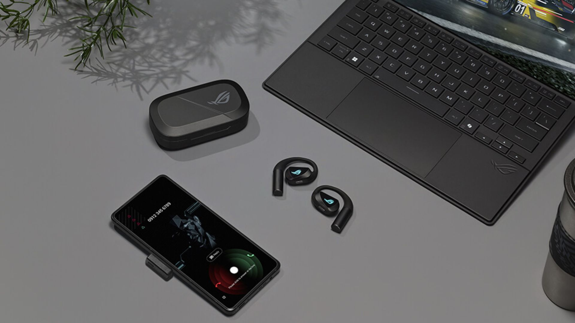 ASUS-ROG-Cetra-Open-Wireless-Gaming-Earbuds-2.4-GHz A photograph of the ASUS ROG Cetra Open Wireless Gaming Earbuds and charging case.