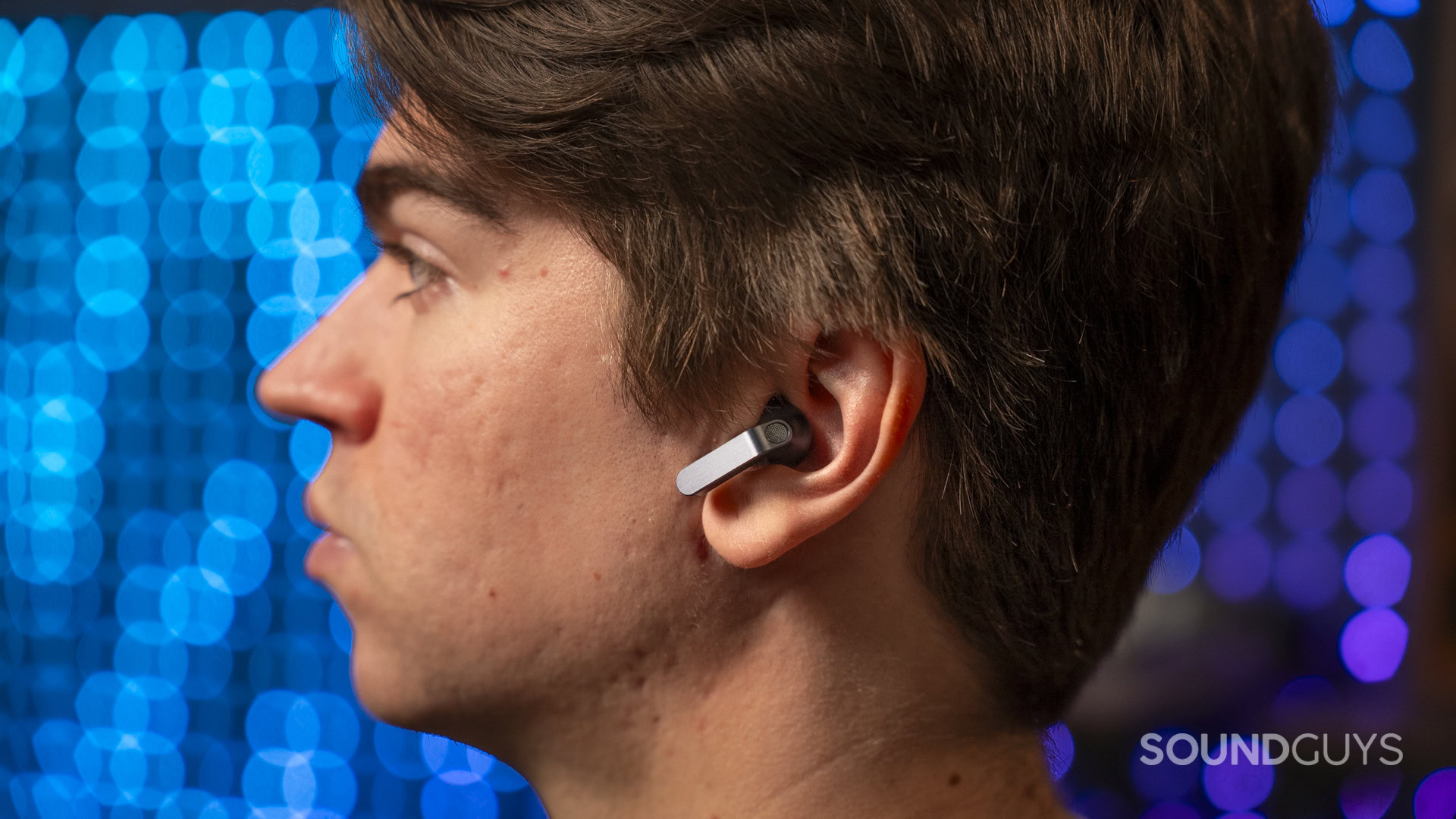 a man wearing the Samsung Galaxy Buds 4 earbuds