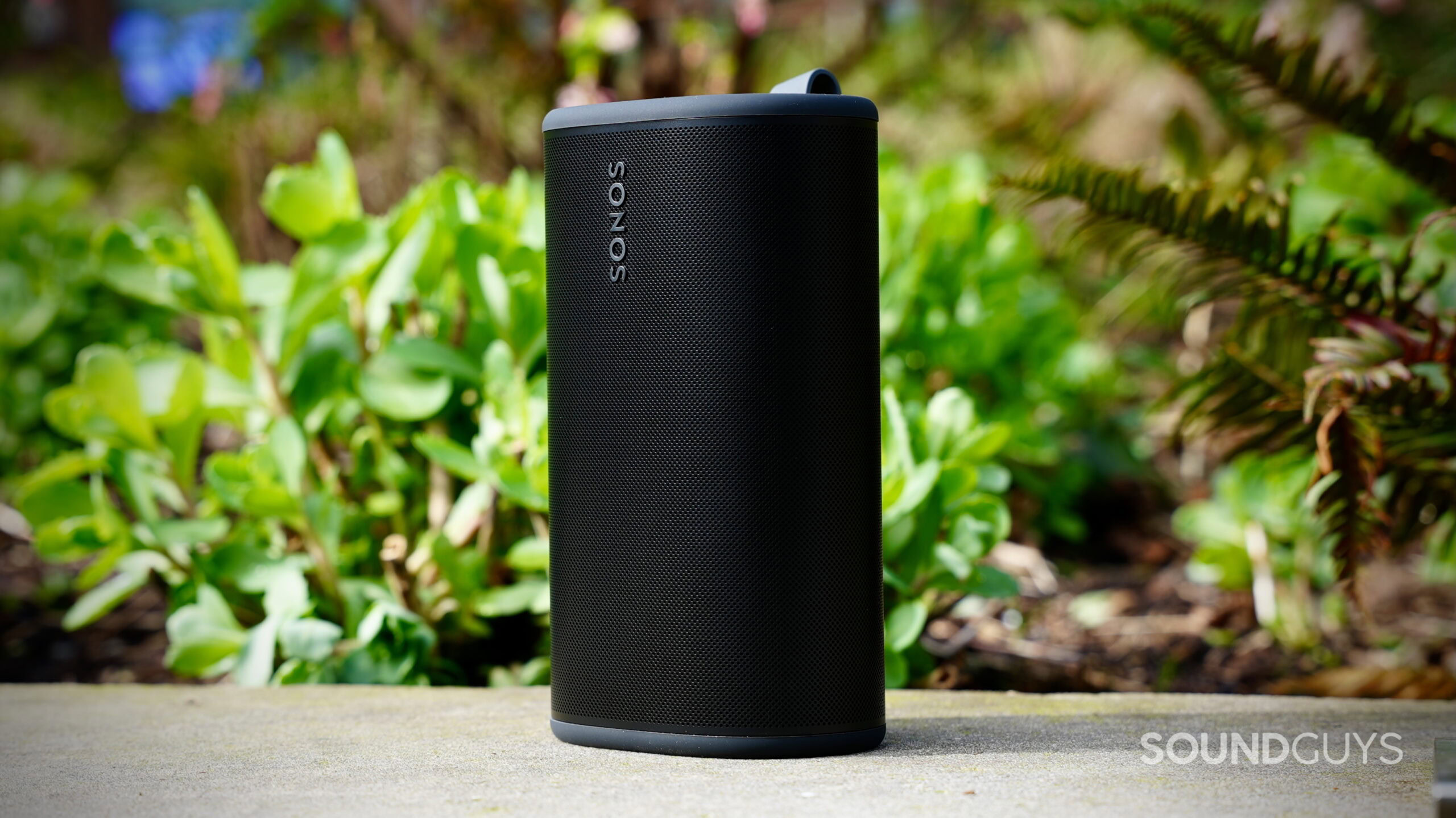 The Sonos Play portable speaker stands out in green in the background.