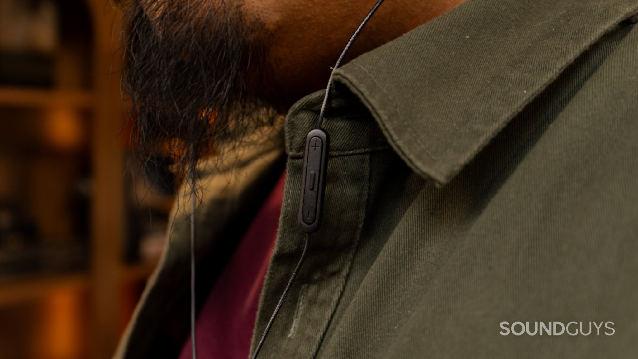 Sony IER-EX15C Controls Inline remote on Sony IER-EX15C cable with volume and control buttons visible against clothing.
