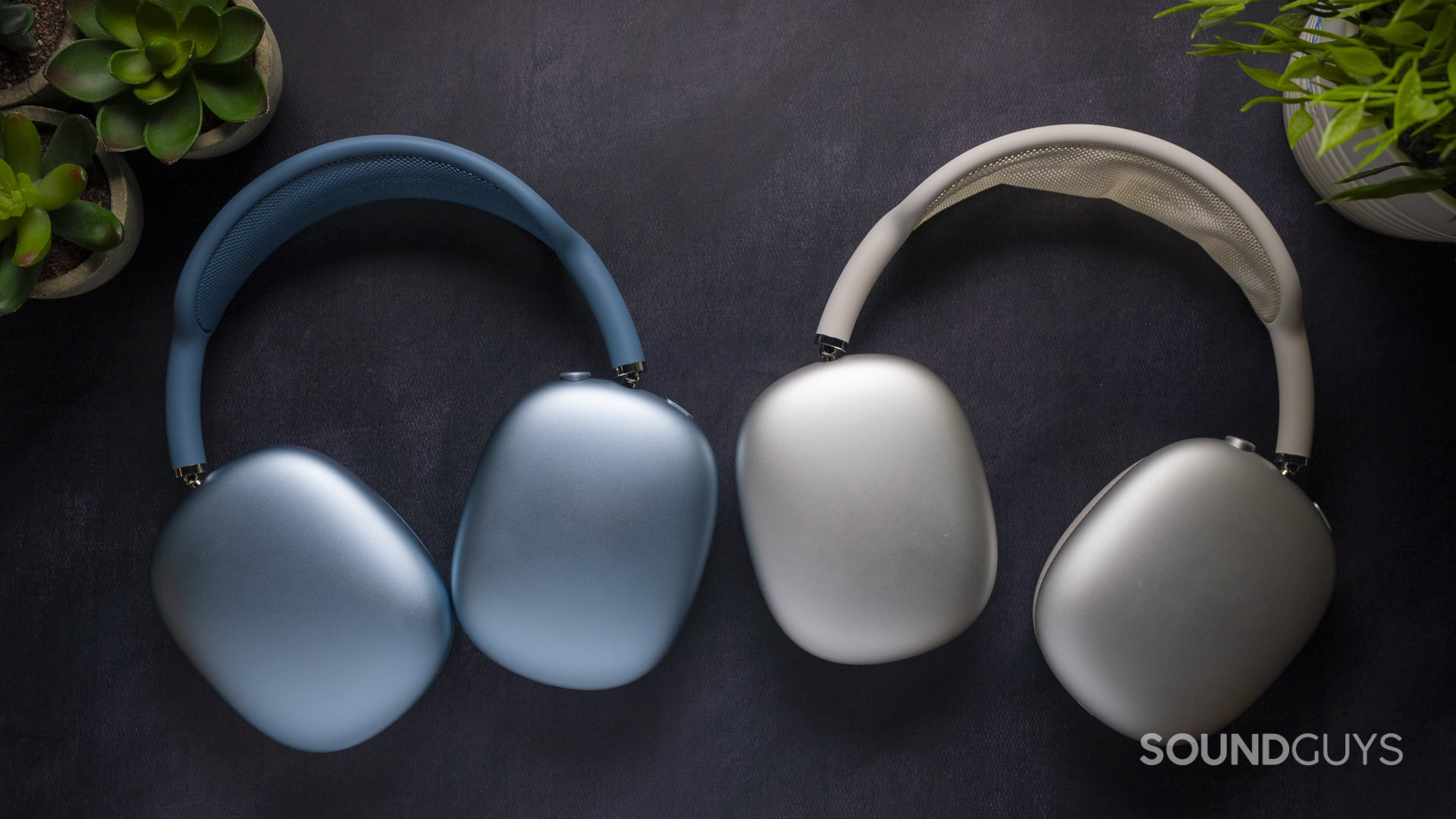 Apple AirPods Max 2 Blue vs Apple AirPods Max 1 Silver face down on the table