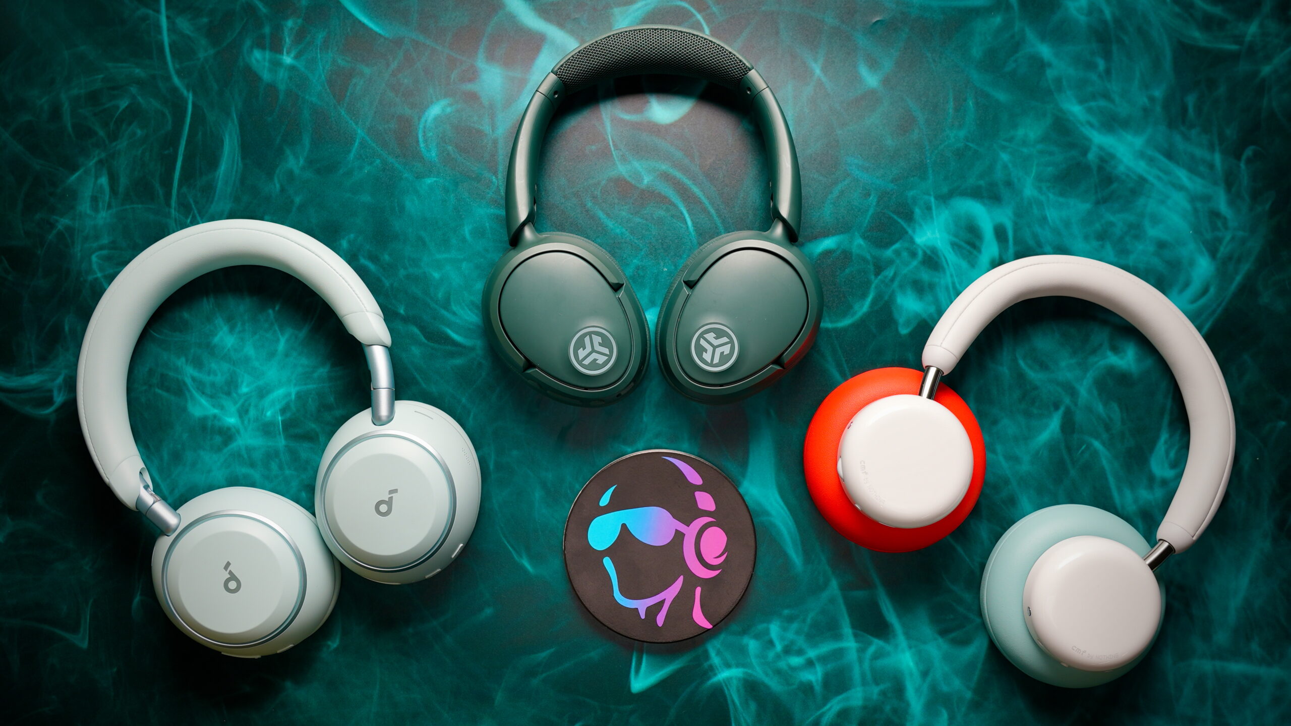 Top down photo of the Space One, Jbuds Lux ANC and Headphone Pro headphones.