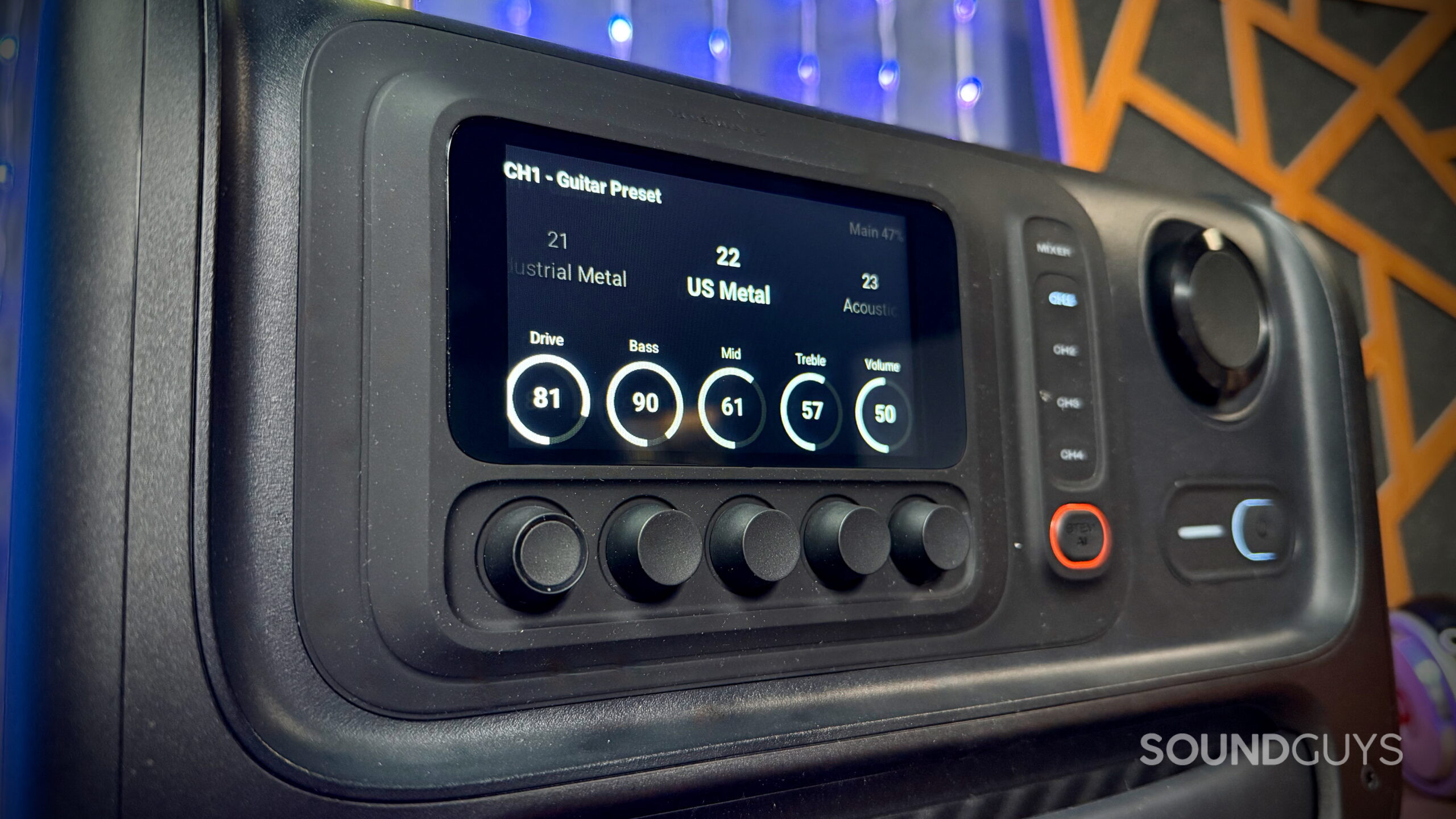 JBL BandBox Trio display featuring US Metal guitar presets with drive, bass, mid, treble, and volume controls.