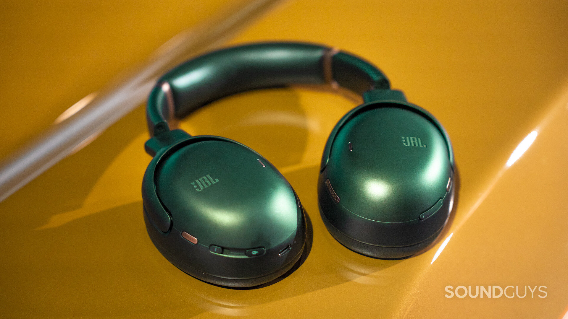 JBL Tour One M3 - 80th Anniversary Edition for 5 years JBL's green over-ear headphones are set in a bright yellow, showing off the internal buttons and USB-C charging port.