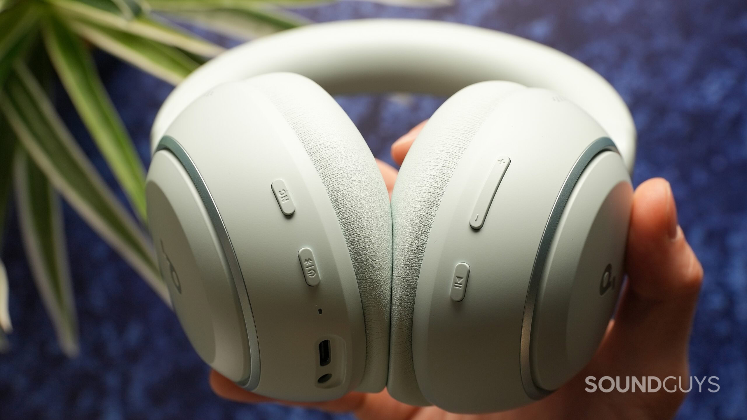 Close-up of the Soundcore Space 2 earcups showing physical buttons, USB-C charging port, and 3.5mm headphone jack.