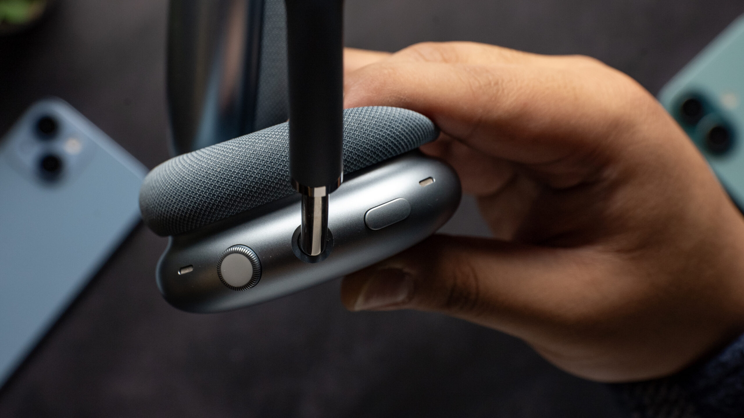 Close up of the Apple AirPods Max 2 headphones digital crown and button.