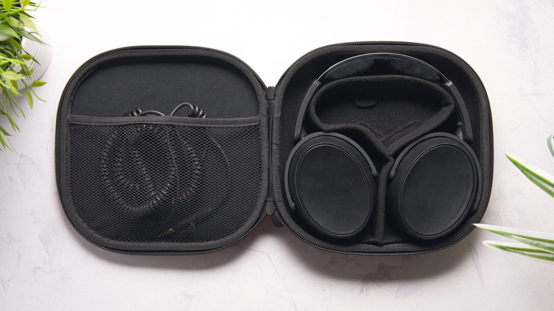 Photo of the Sennheiser HD 480 Pro Plus sitting on its walk-in stand.