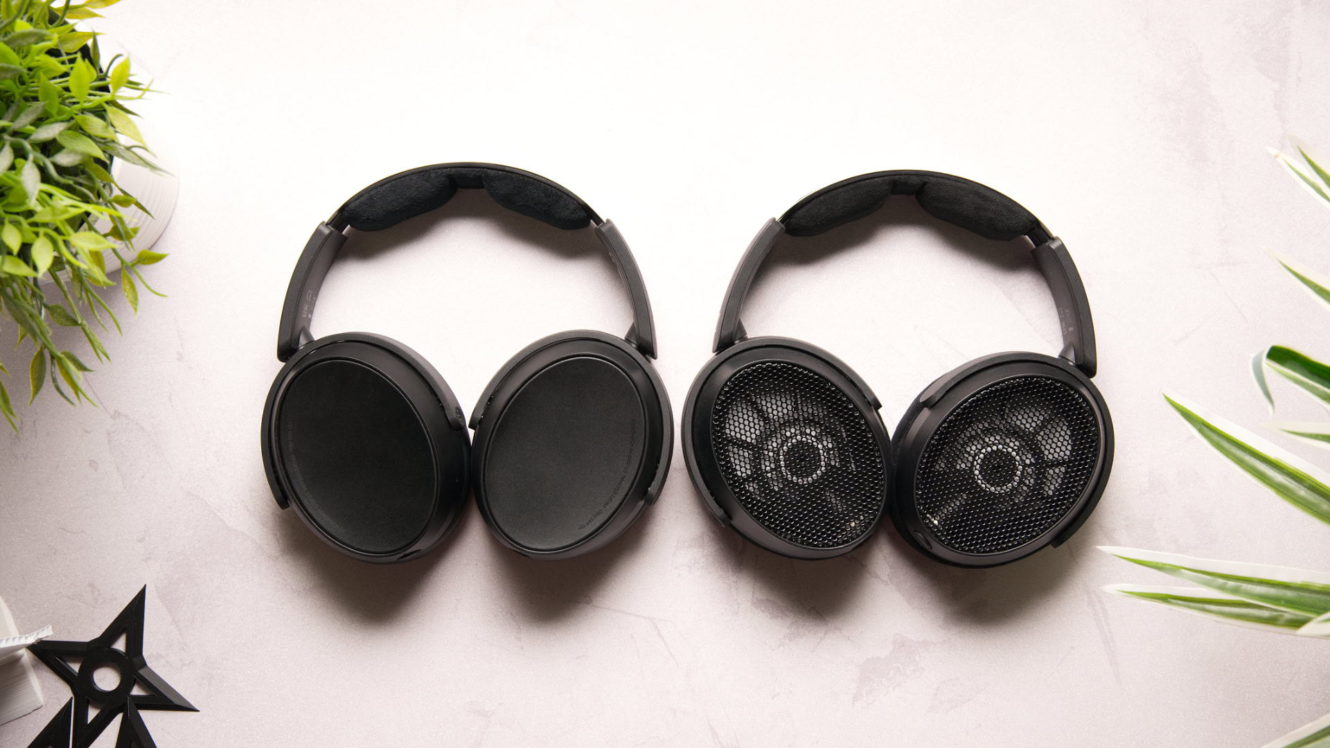 Photo showing the Sennheiser HD 480 Pro Plus next to the HD 490 Pro on a white desk.