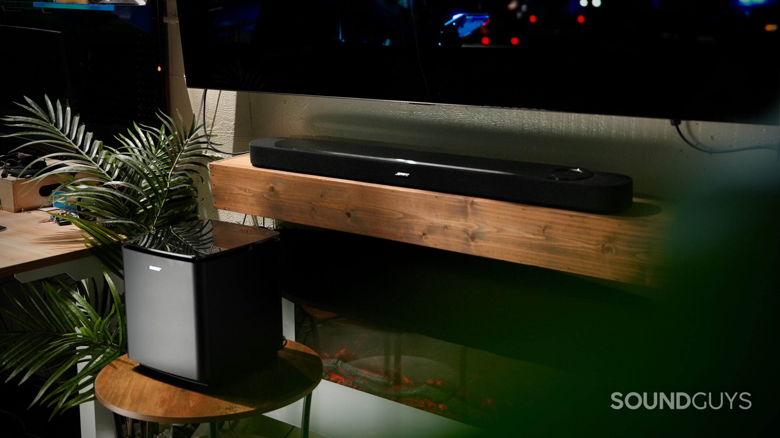 Bose Lifestyle Soundbar - 1 Bose Lifestyle Ultra Soundbar and Lifestyle Ultra Subwoofer setup beneath a wall-mounted TV.